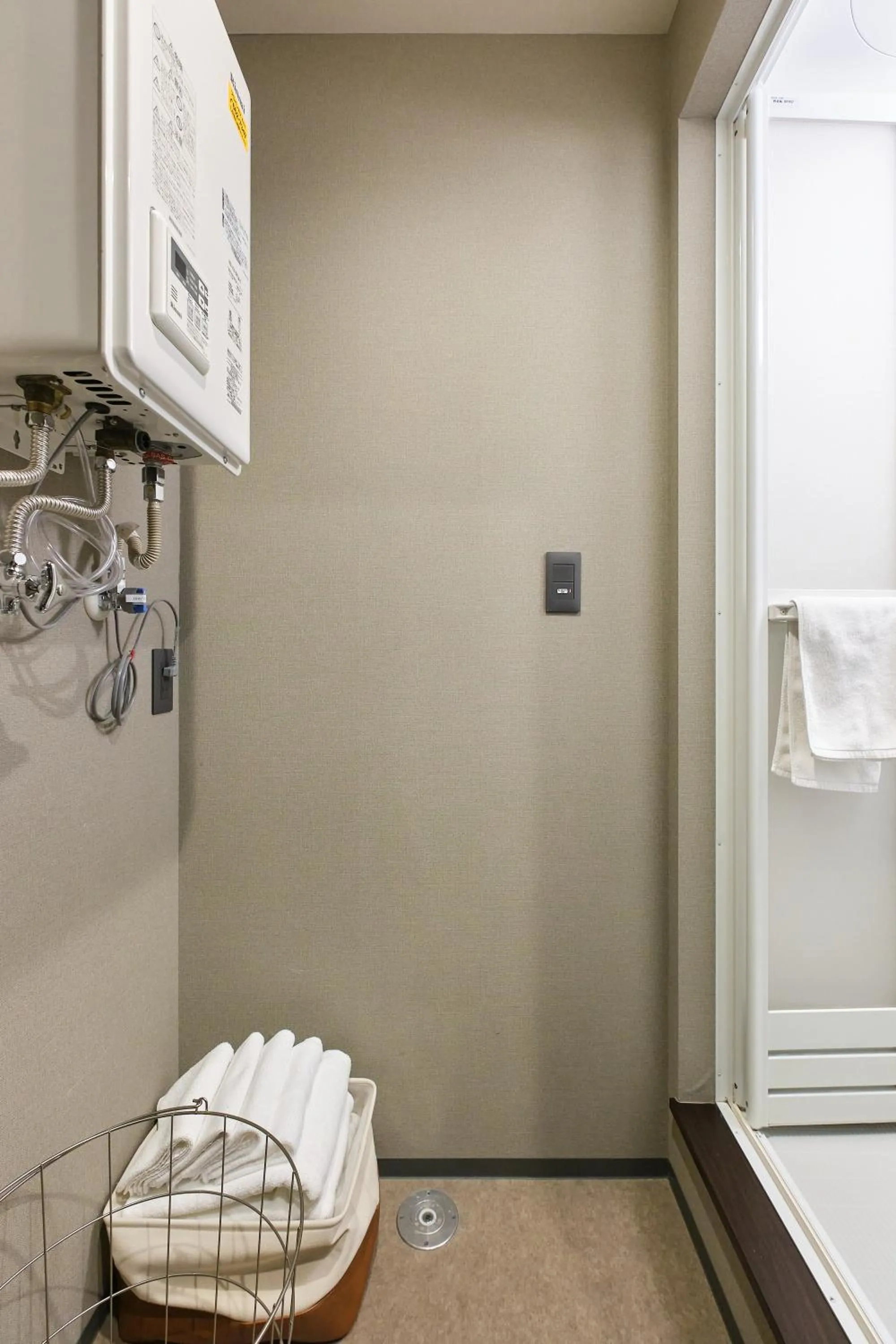 towels in UCHI SUSUKINO WEST by Hotel Wheat