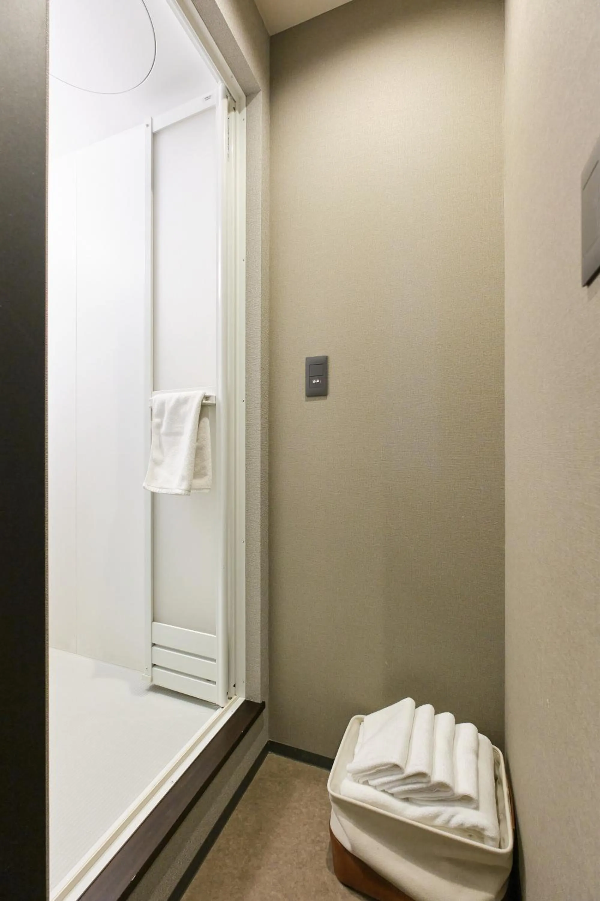 towels in UCHI SUSUKINO WEST by Hotel Wheat