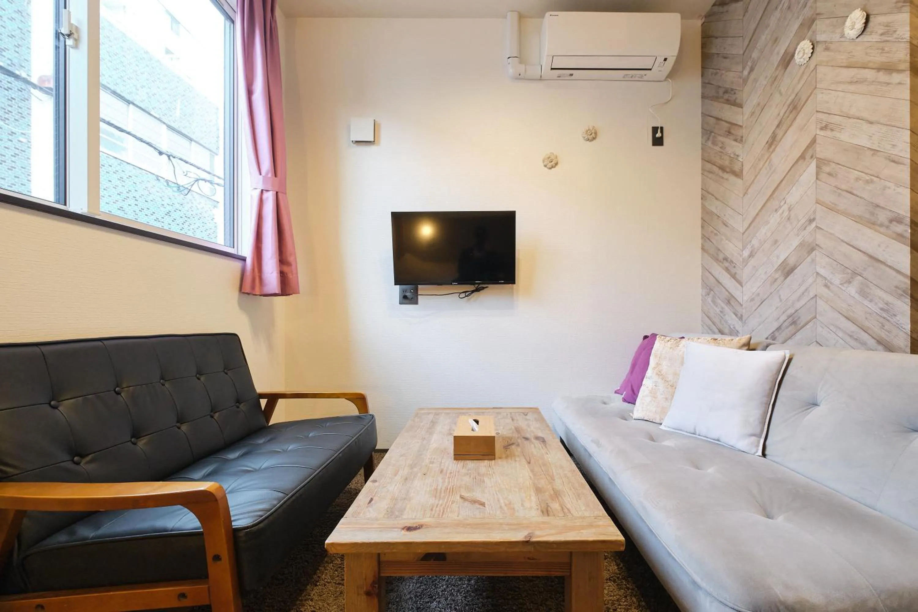 Living room in UCHI SUSUKINO WEST by Hotel Wheat