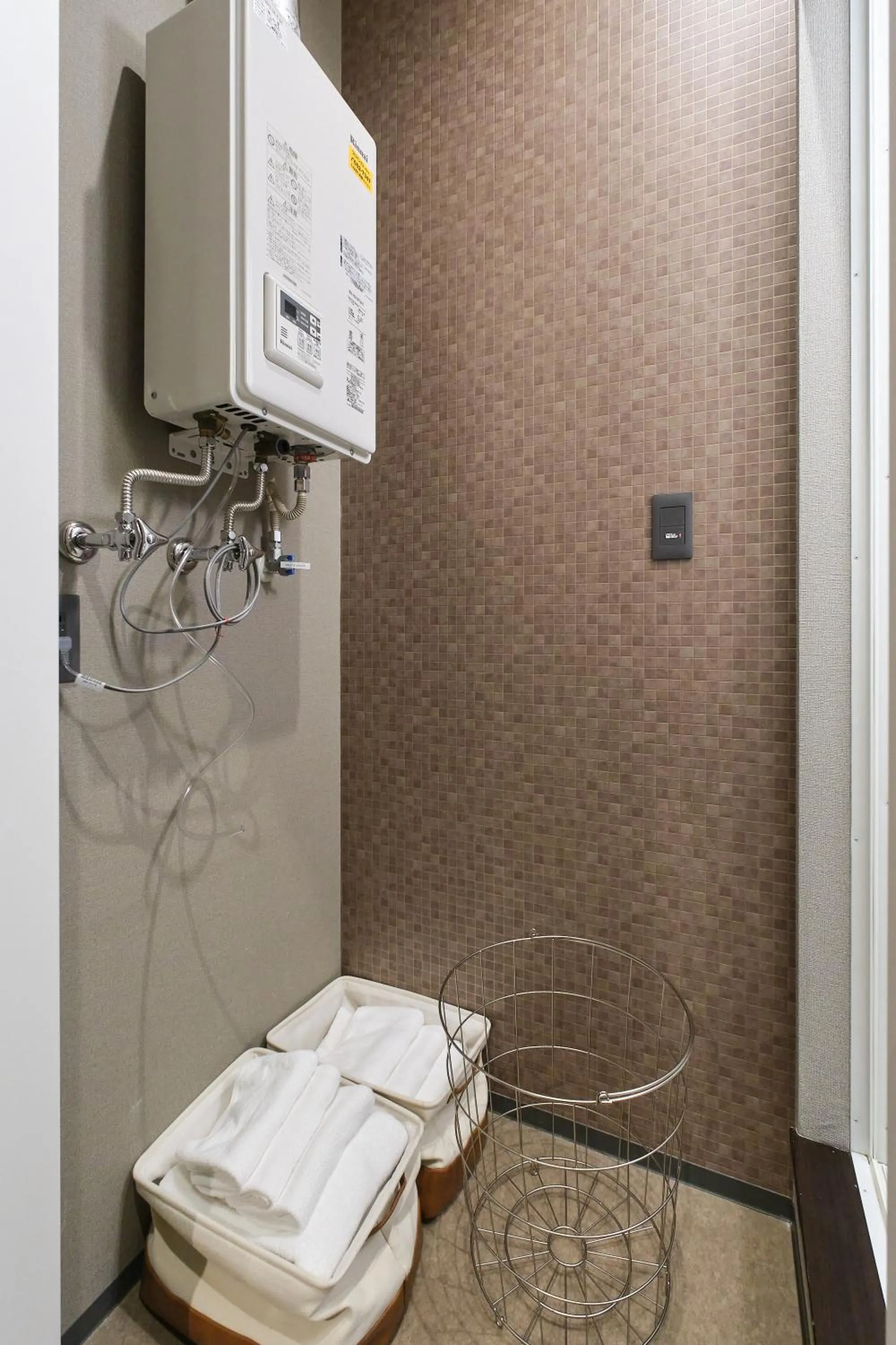 towels in UCHI SUSUKINO WEST by Hotel Wheat