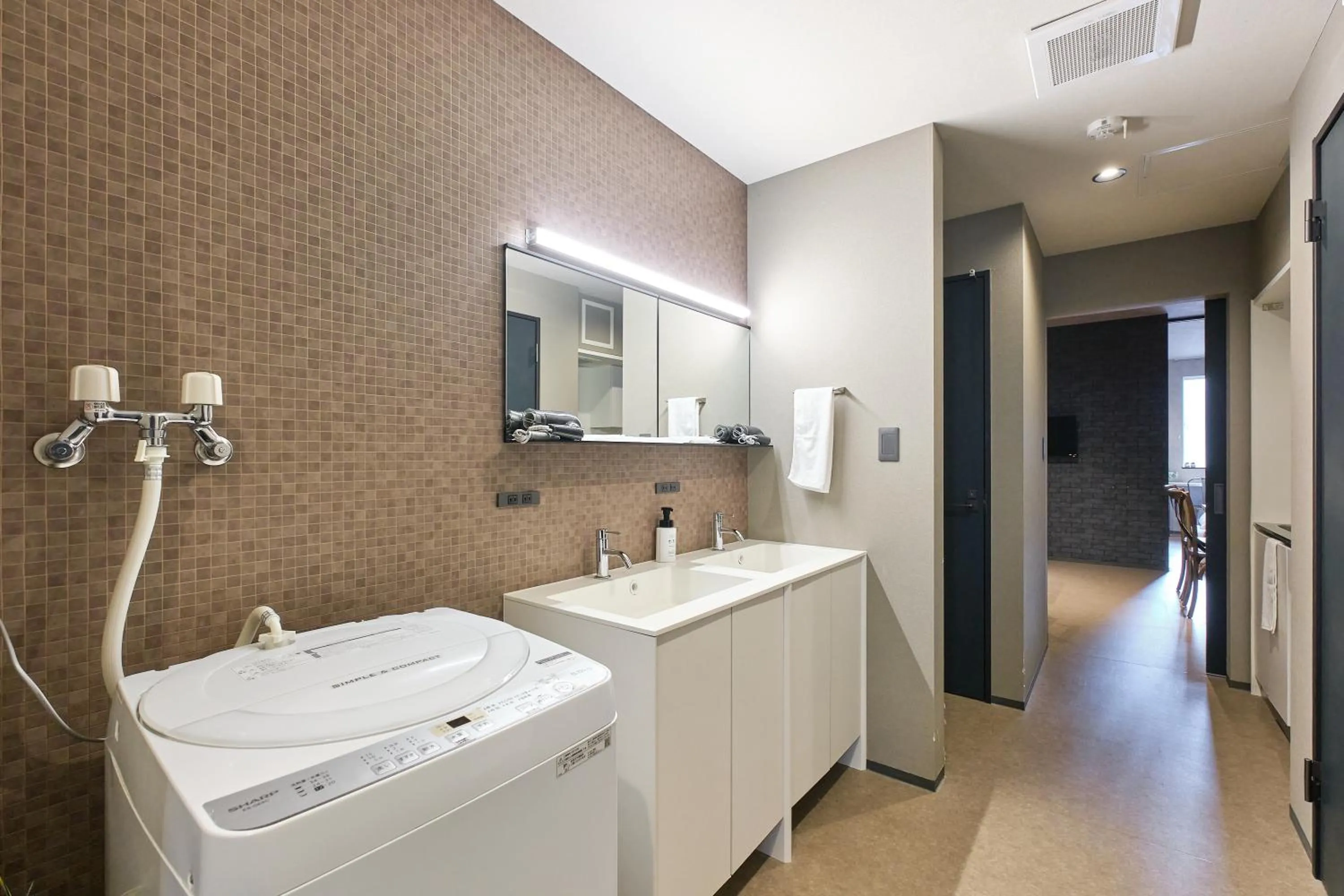 laundry in UCHI SUSUKINO WEST by Hotel Wheat