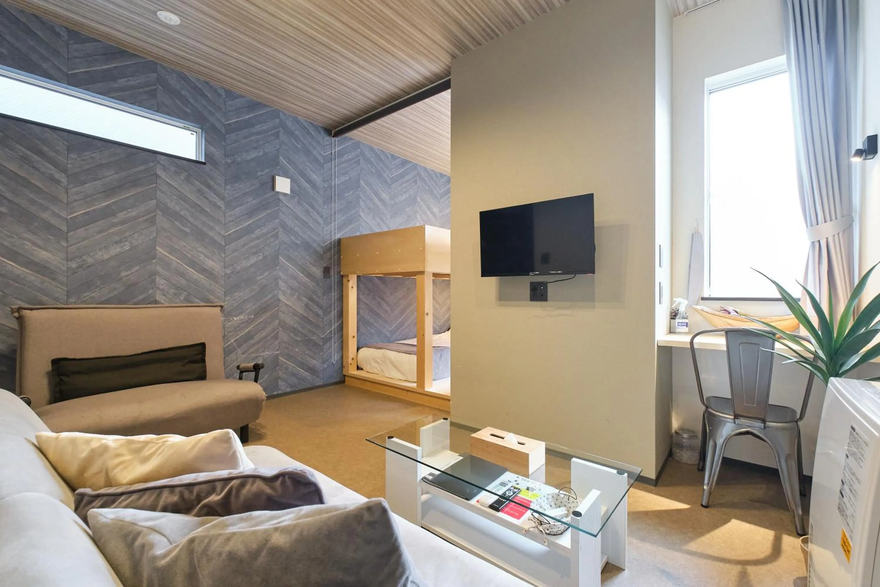 Living room in UCHI SUSUKINO WEST by Hotel Wheat