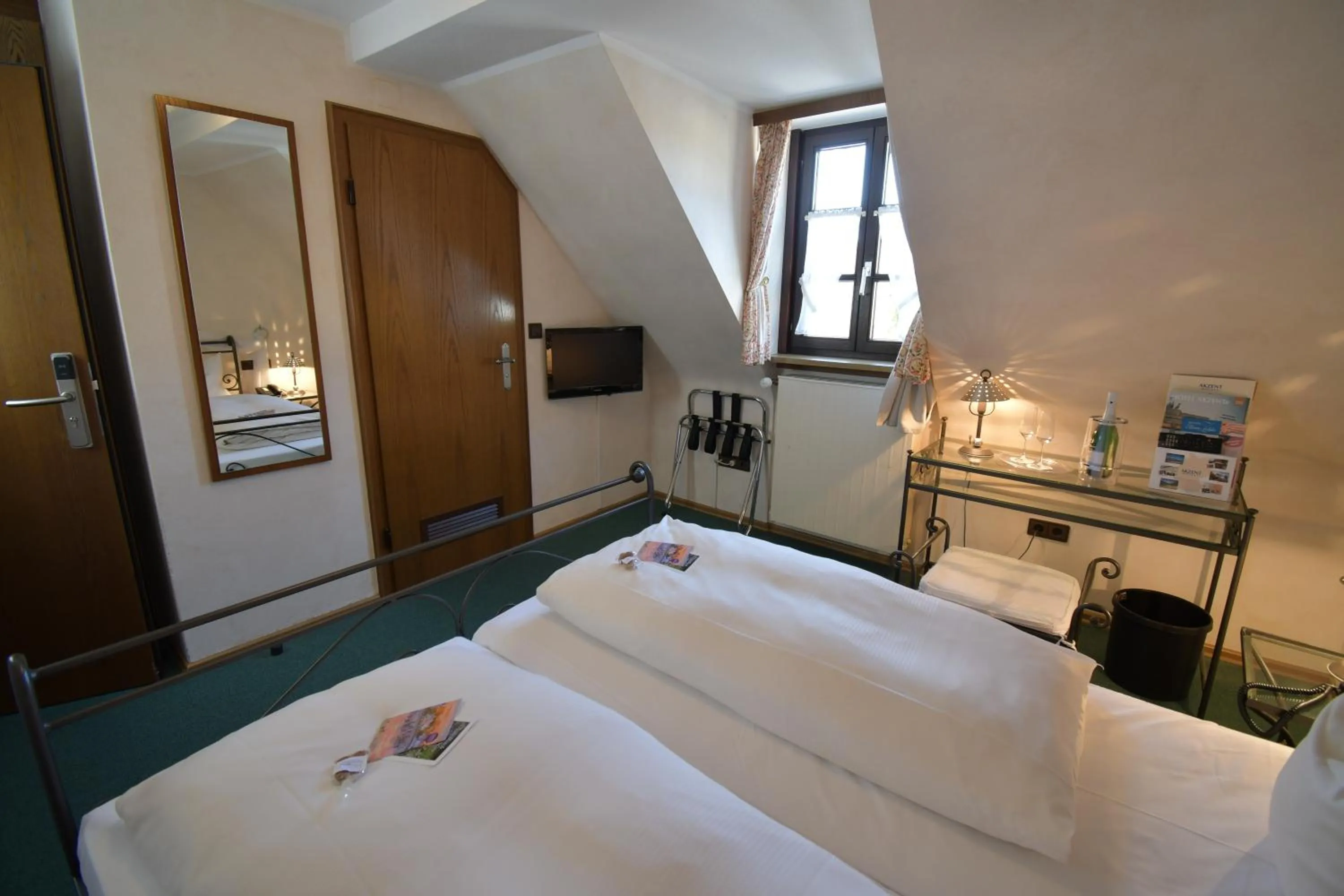 Photo of the whole room, Bed in AKZENT Hotel Franziskaner