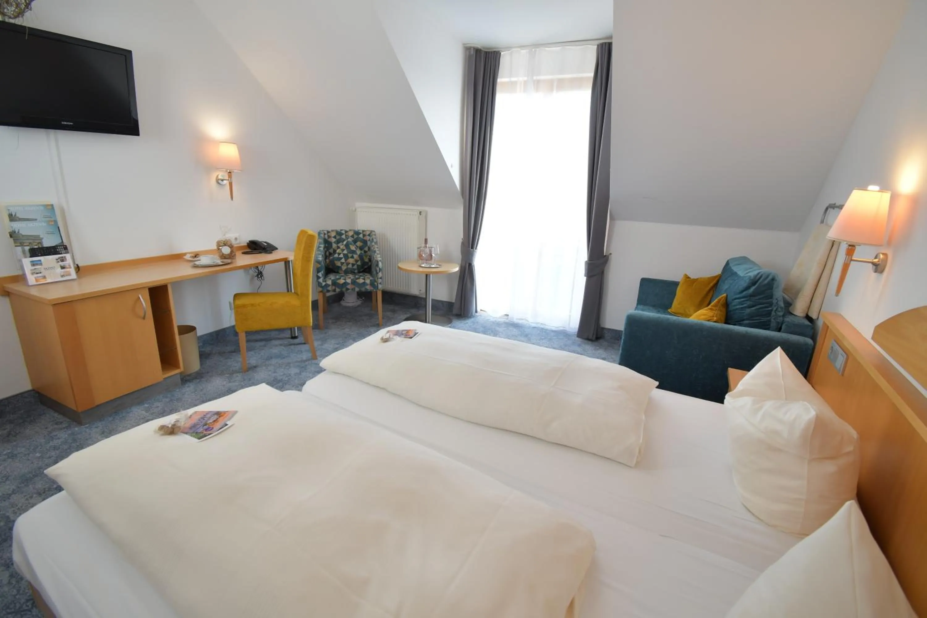 Photo of the whole room, Bed in AKZENT Hotel Franziskaner