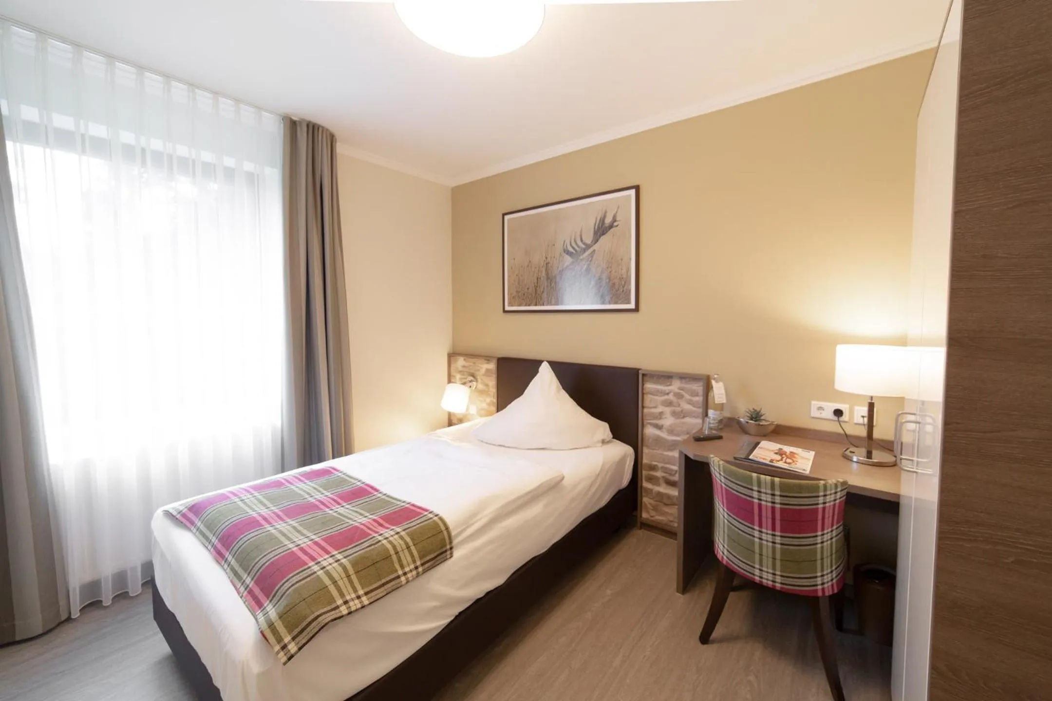 Photo of the whole room, Bed in AKZENT Hotel Thiemann