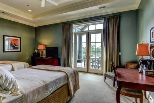 Bed in Cottages and Suites at River Landing