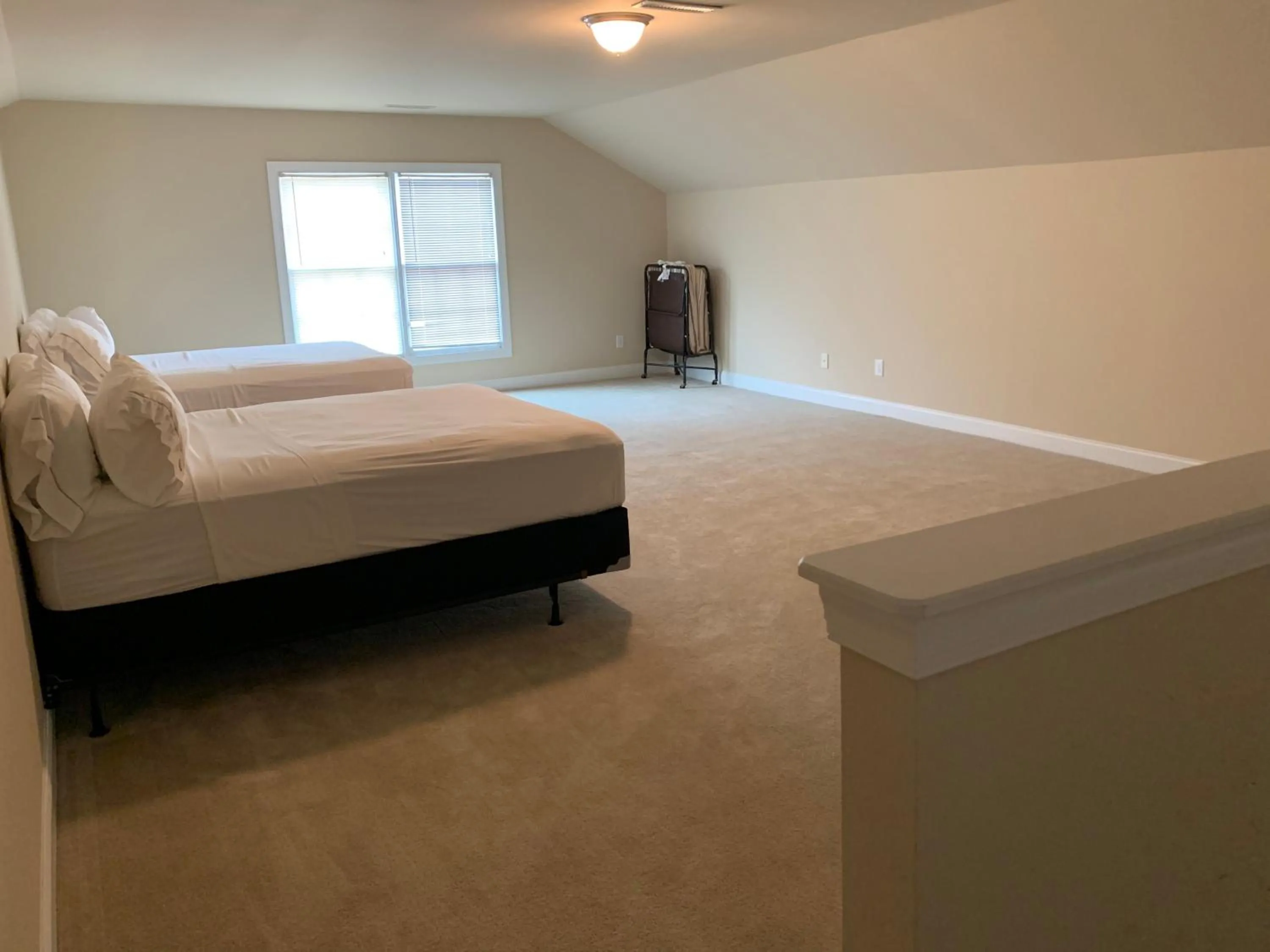 Bed in Cottages and Suites at River Landing