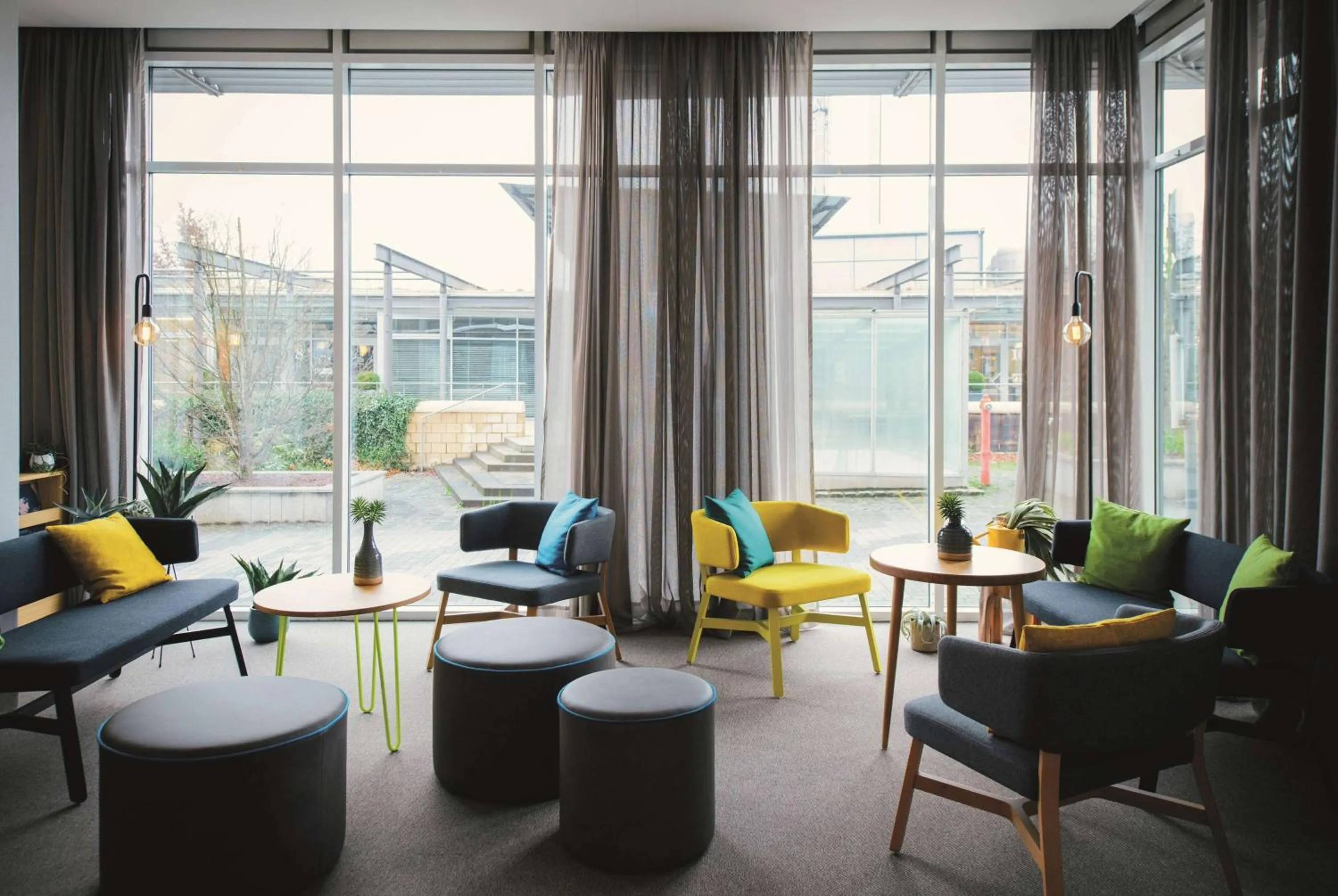 Lobby or reception in Vienna House Easy by Wyndham Bad Oeynhausen