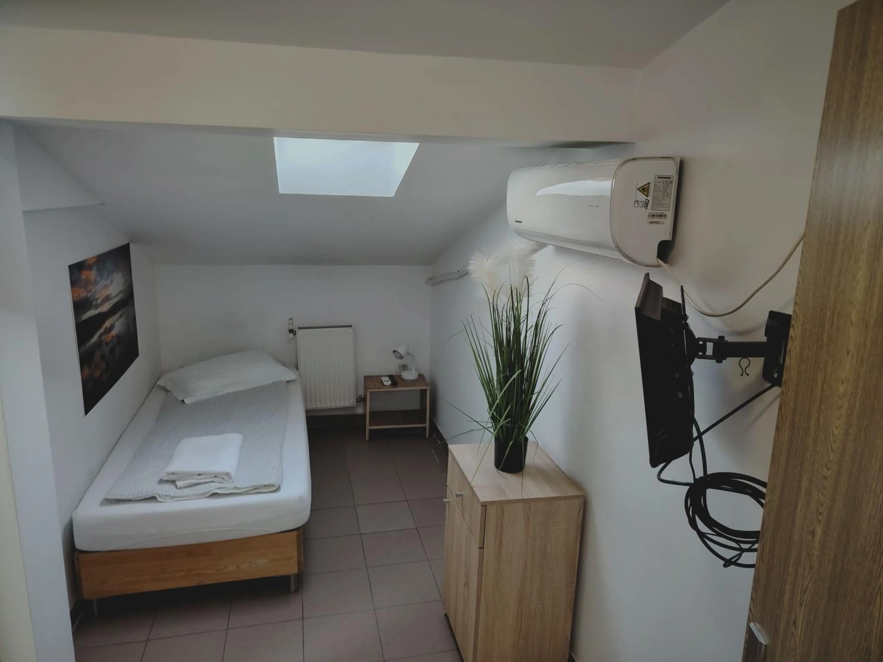 Bed in Piata Uniri Cozy Inn