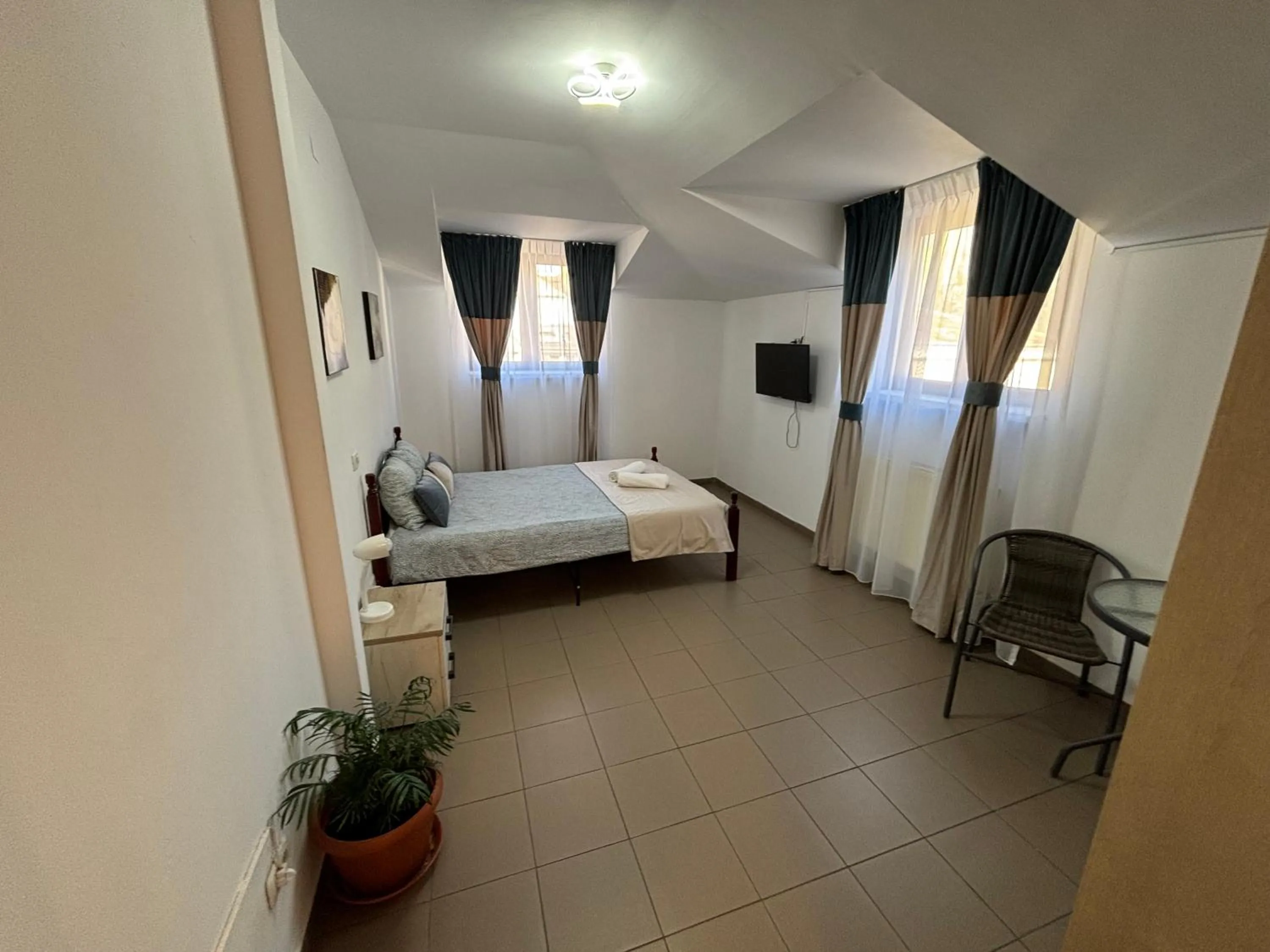 Bed in Piata Uniri Cozy Inn