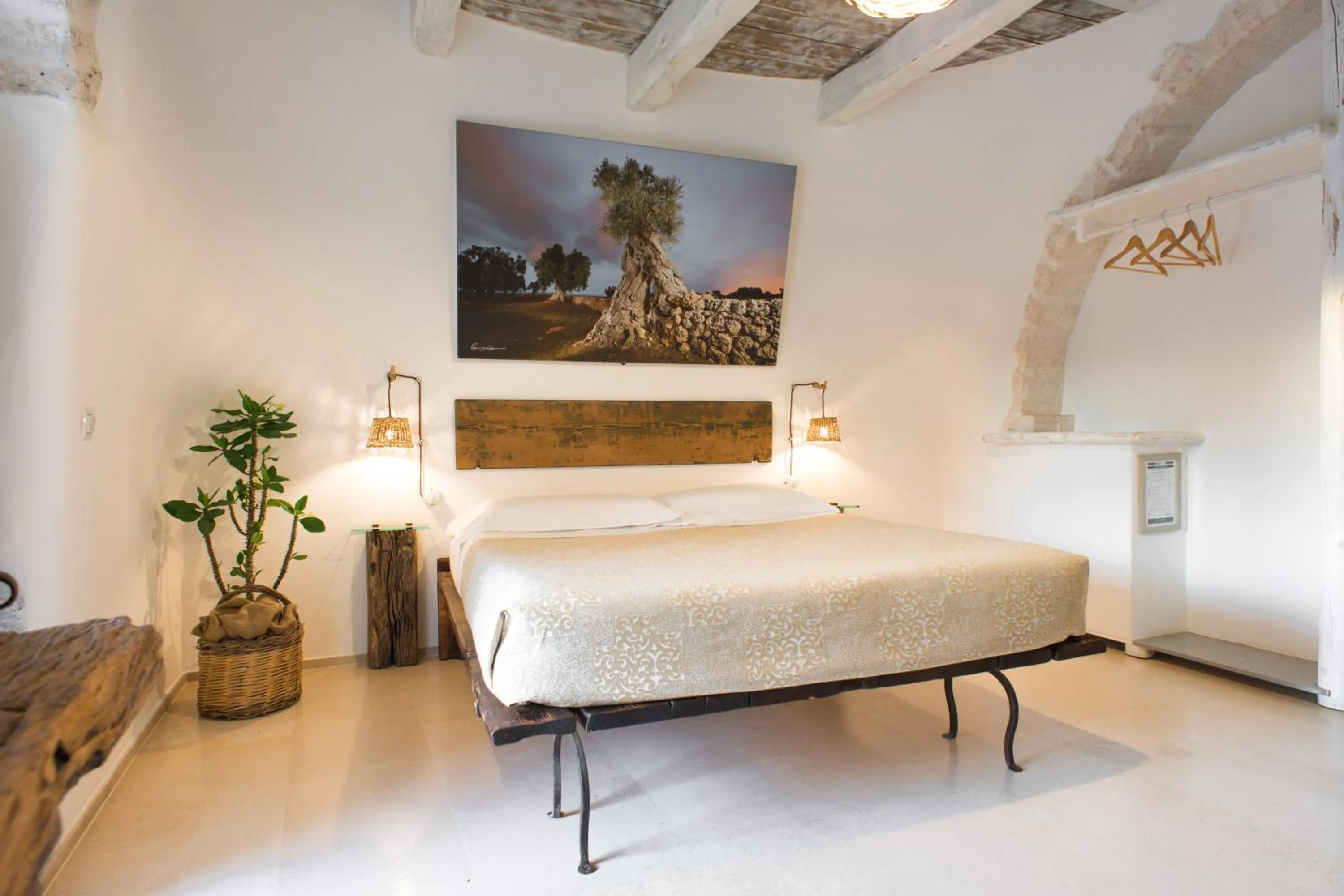 Bed in Trulli Holiday Deluxe & Wellness