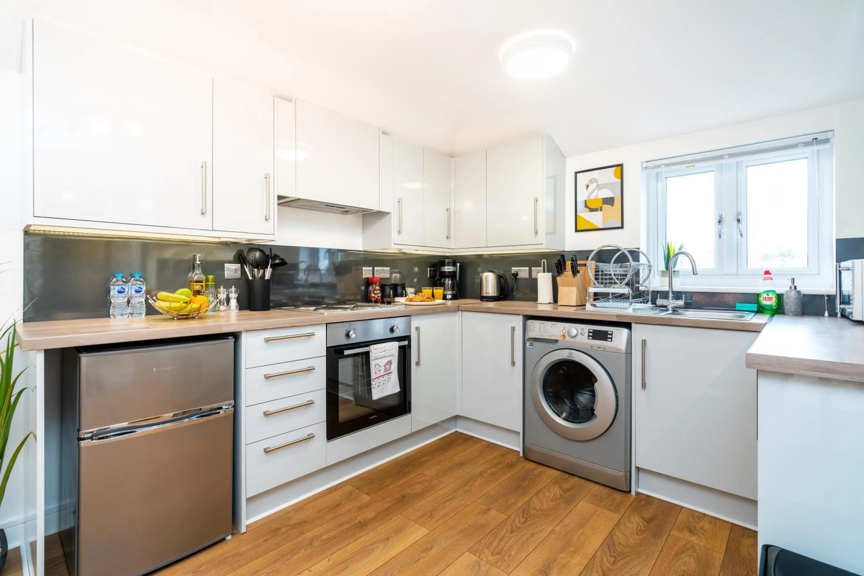 Kitchen or kitchenette in Town Center Apartment with 55” Smart TV+Netflix