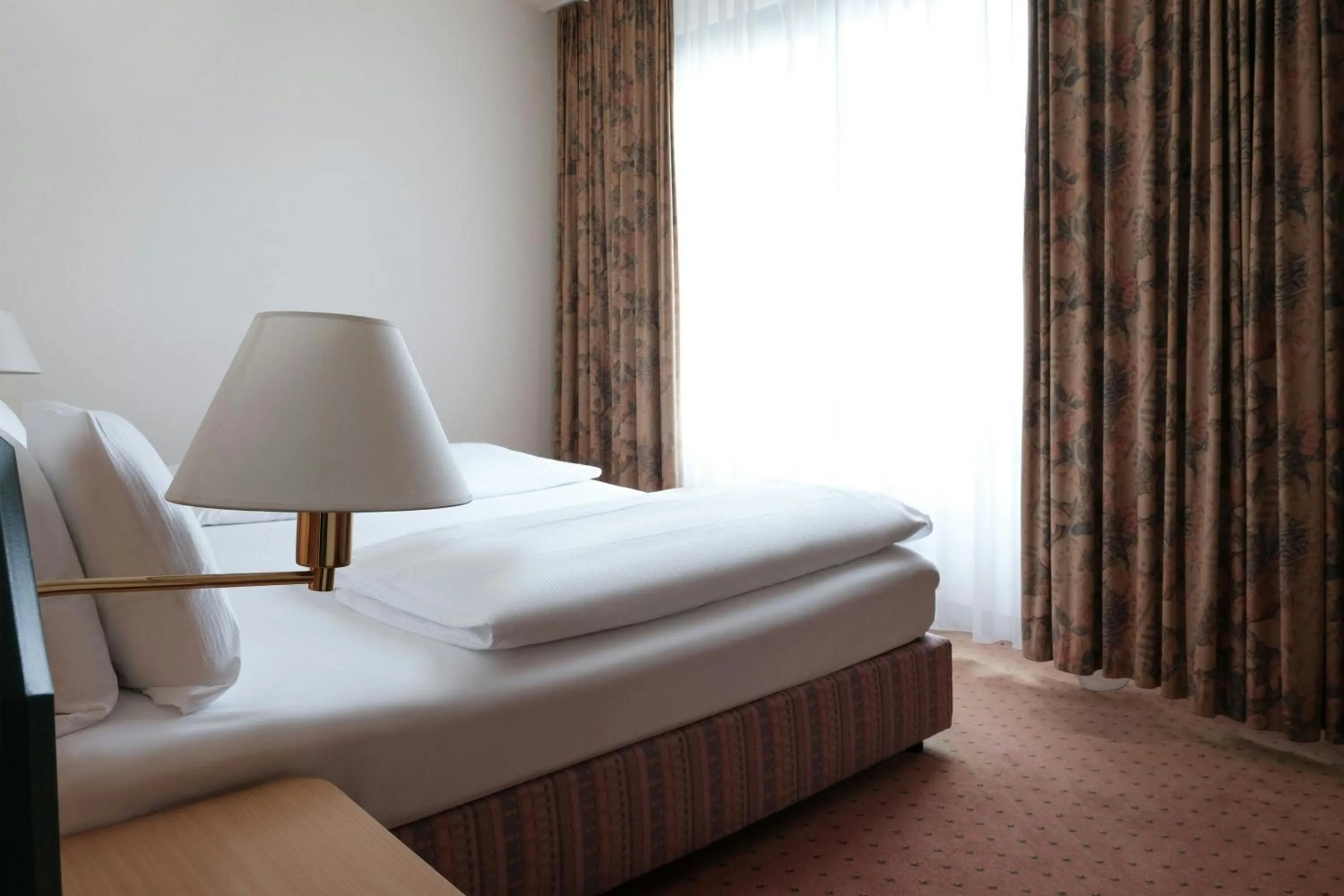 Bedroom, Bed in Holiday Inn Essen City Centre, an IHG Hotel