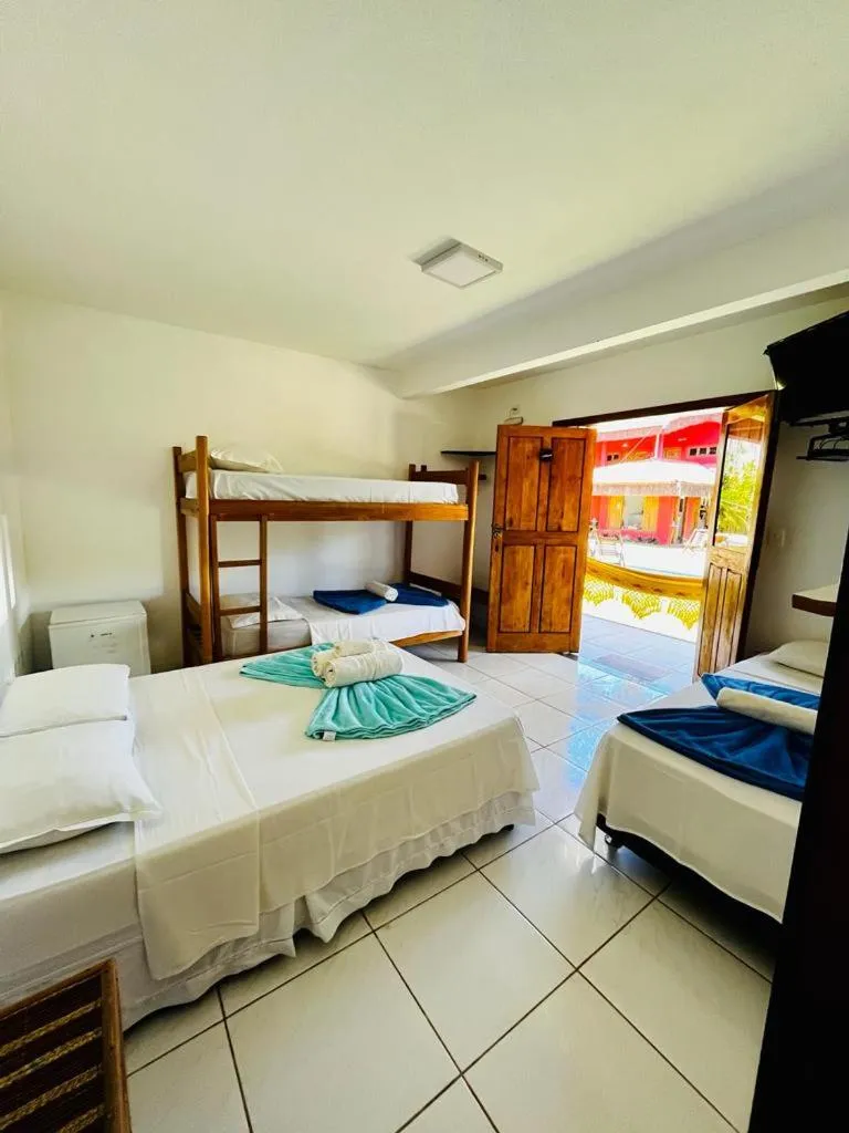 Bed in Pousada Perola da Barra