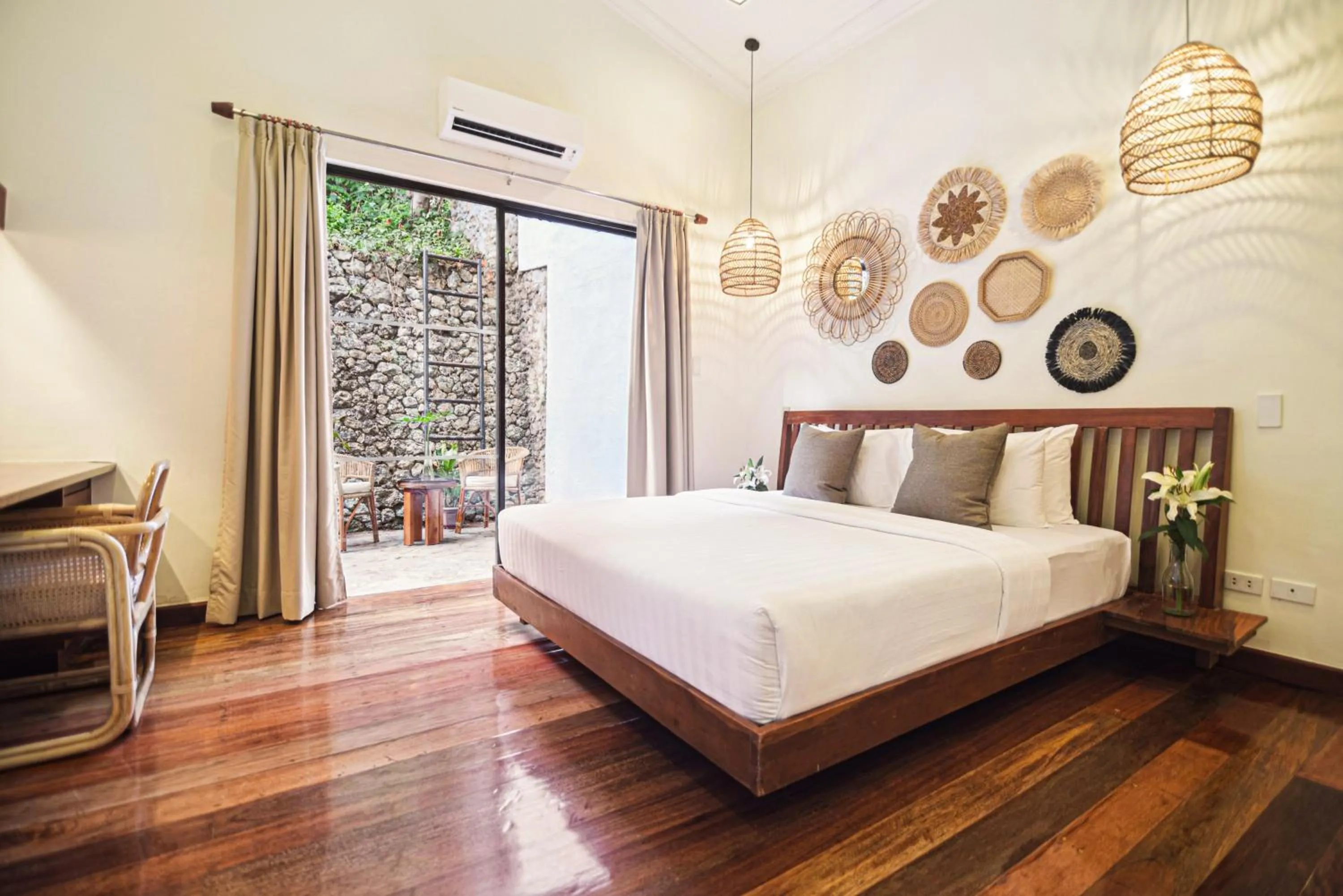 Bed in The Strand Boutique Resort
