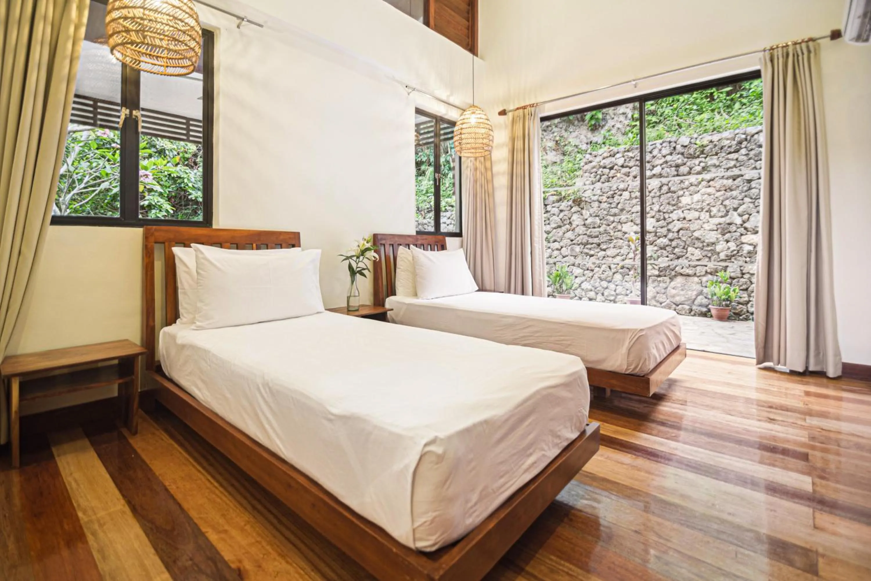 Bed in The Strand Boutique Resort