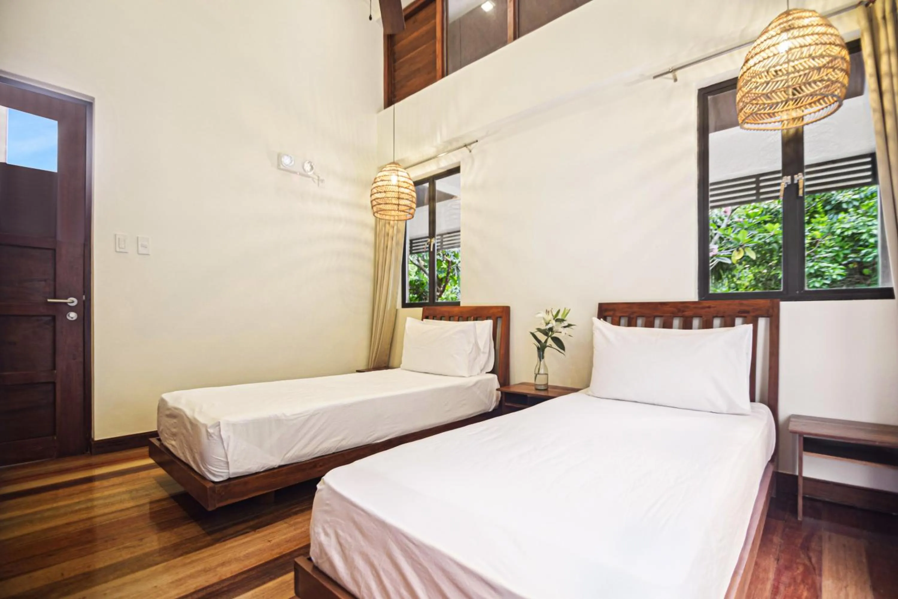 Bed in The Strand Boutique Resort