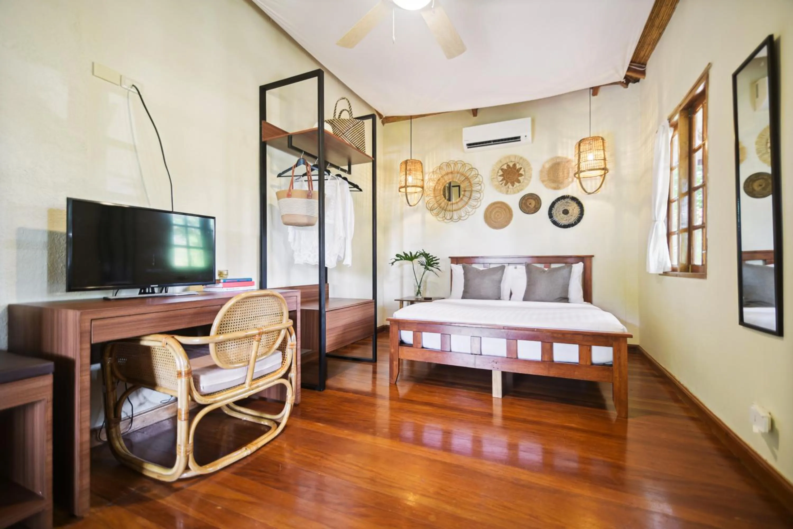 Bed in The Strand Boutique Resort