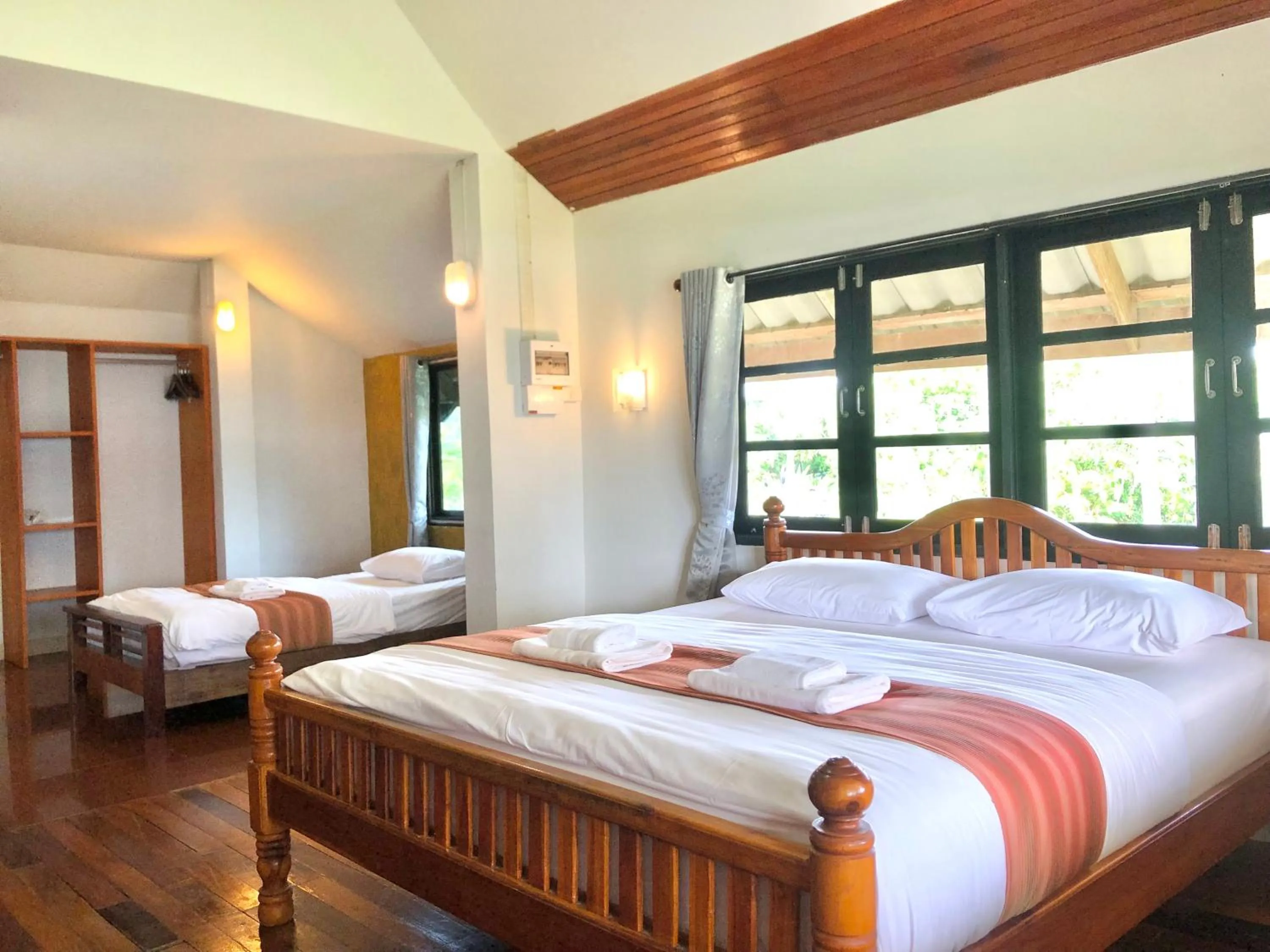 Bed in The Chevalley Beach Resort