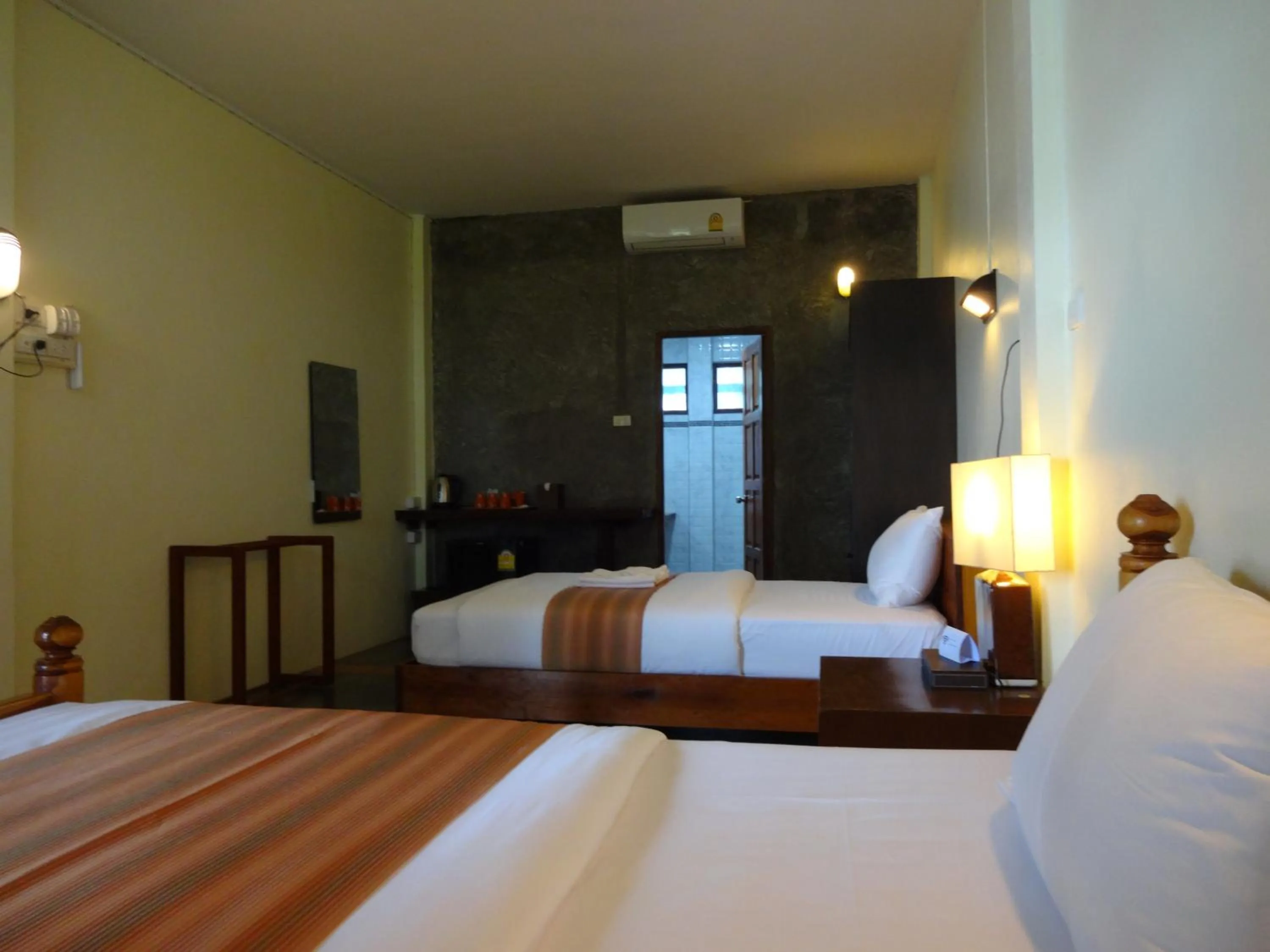 Bed in The Chevalley Beach Resort