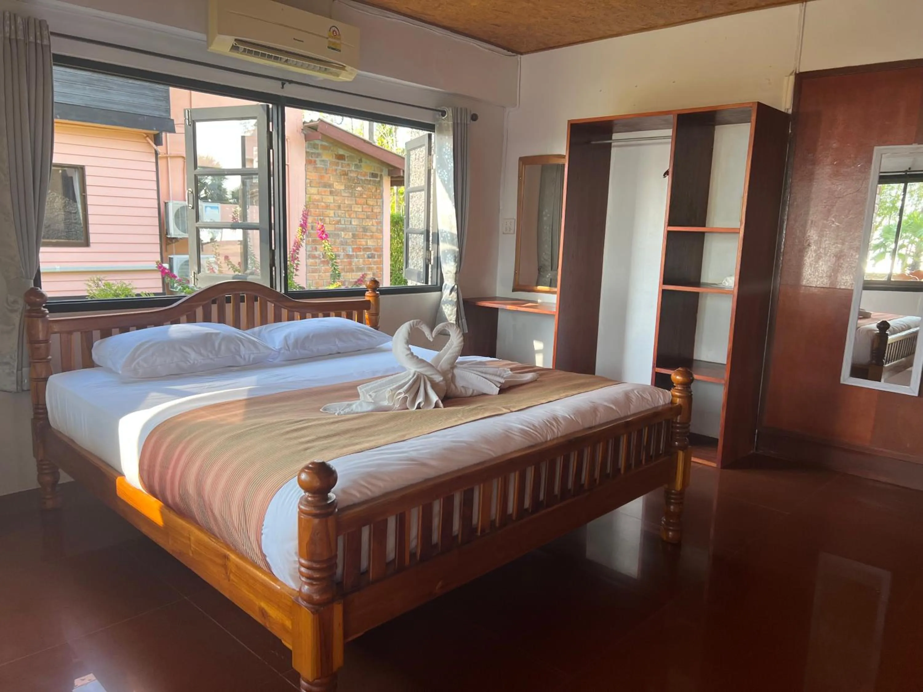 Bed in The Chevalley Beach Resort