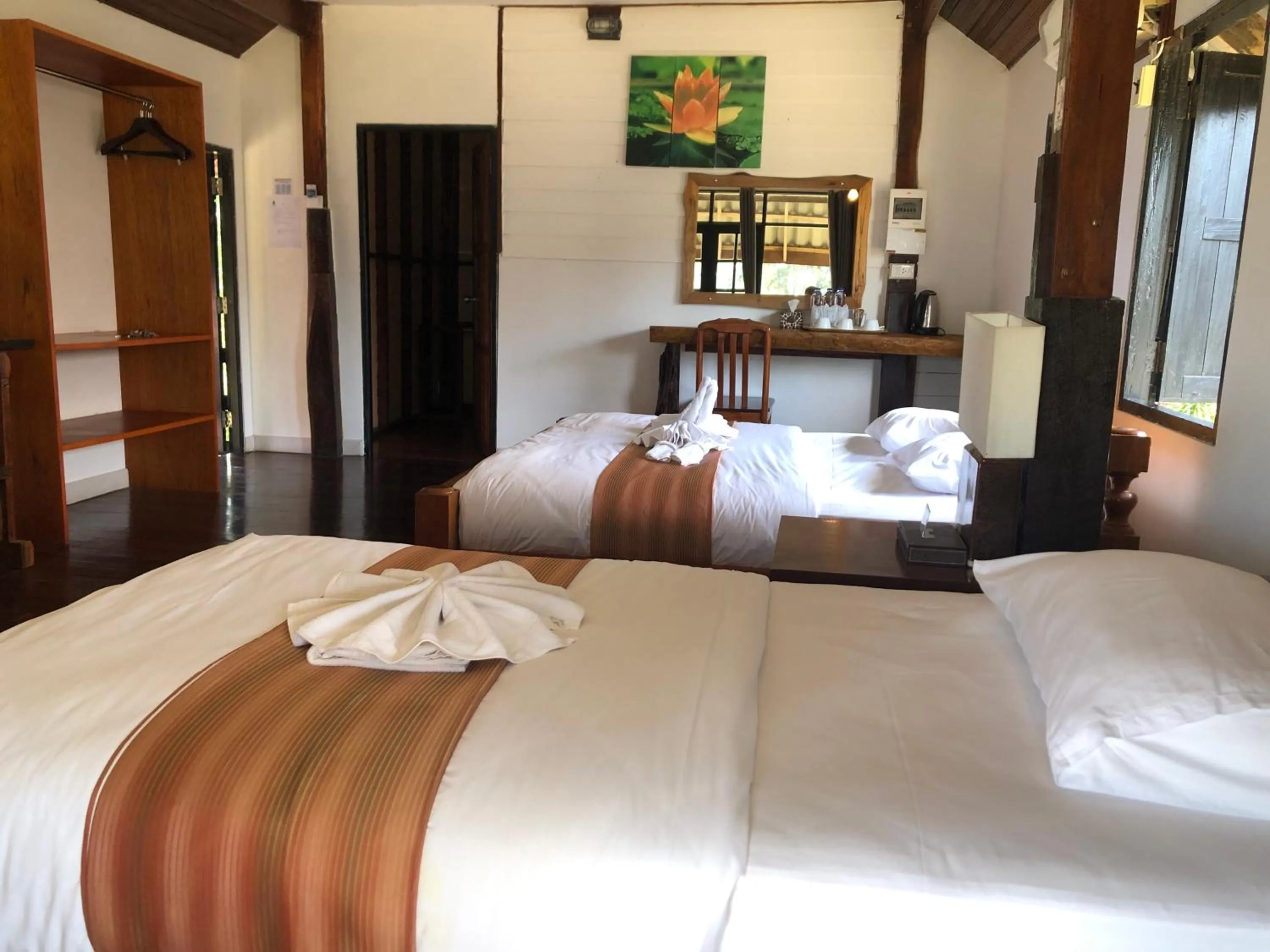 Bed in The Chevalley Beach Resort