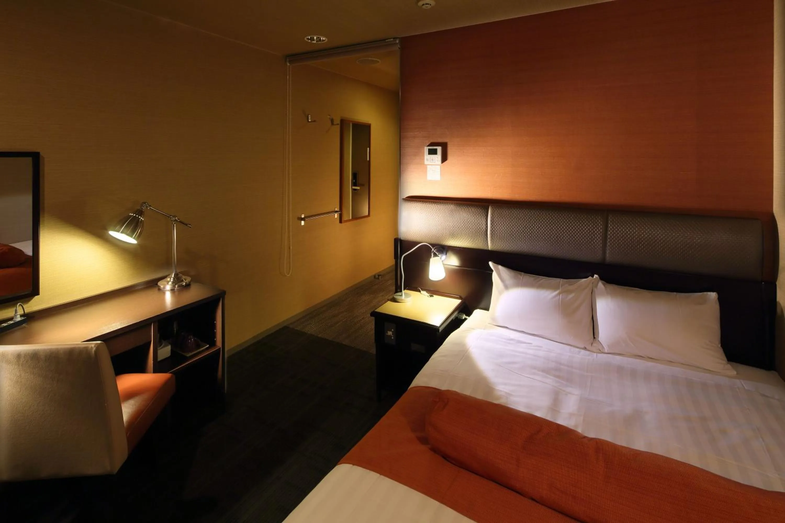 Bed in Hotel Quest Shimizu