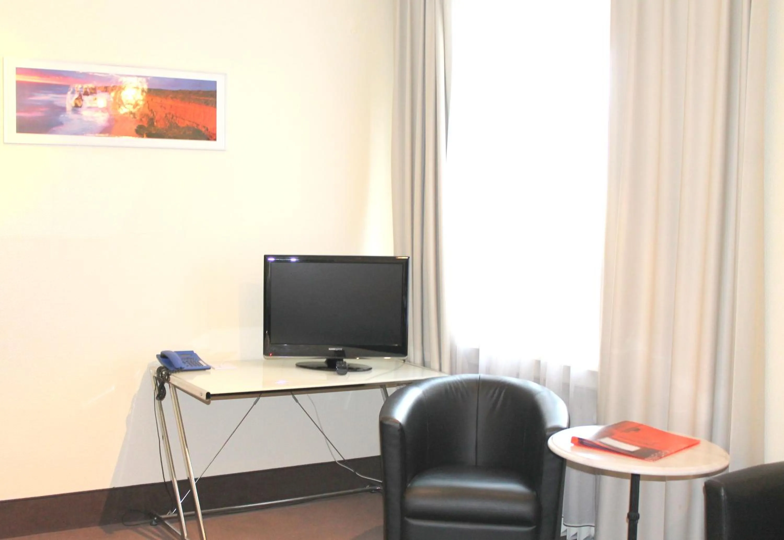 TV and multimedia, TV/Entertainment Center in Monopol Hotel