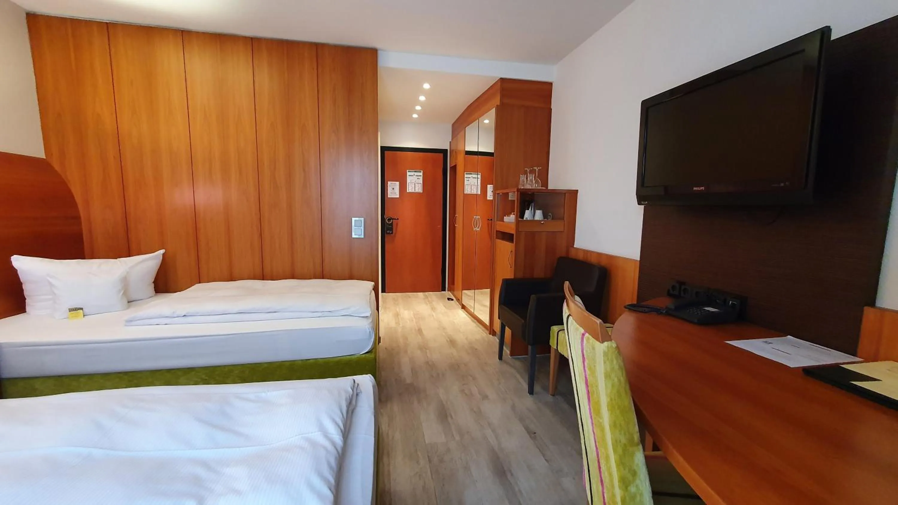 Bed in Astralis Hotel Domizil