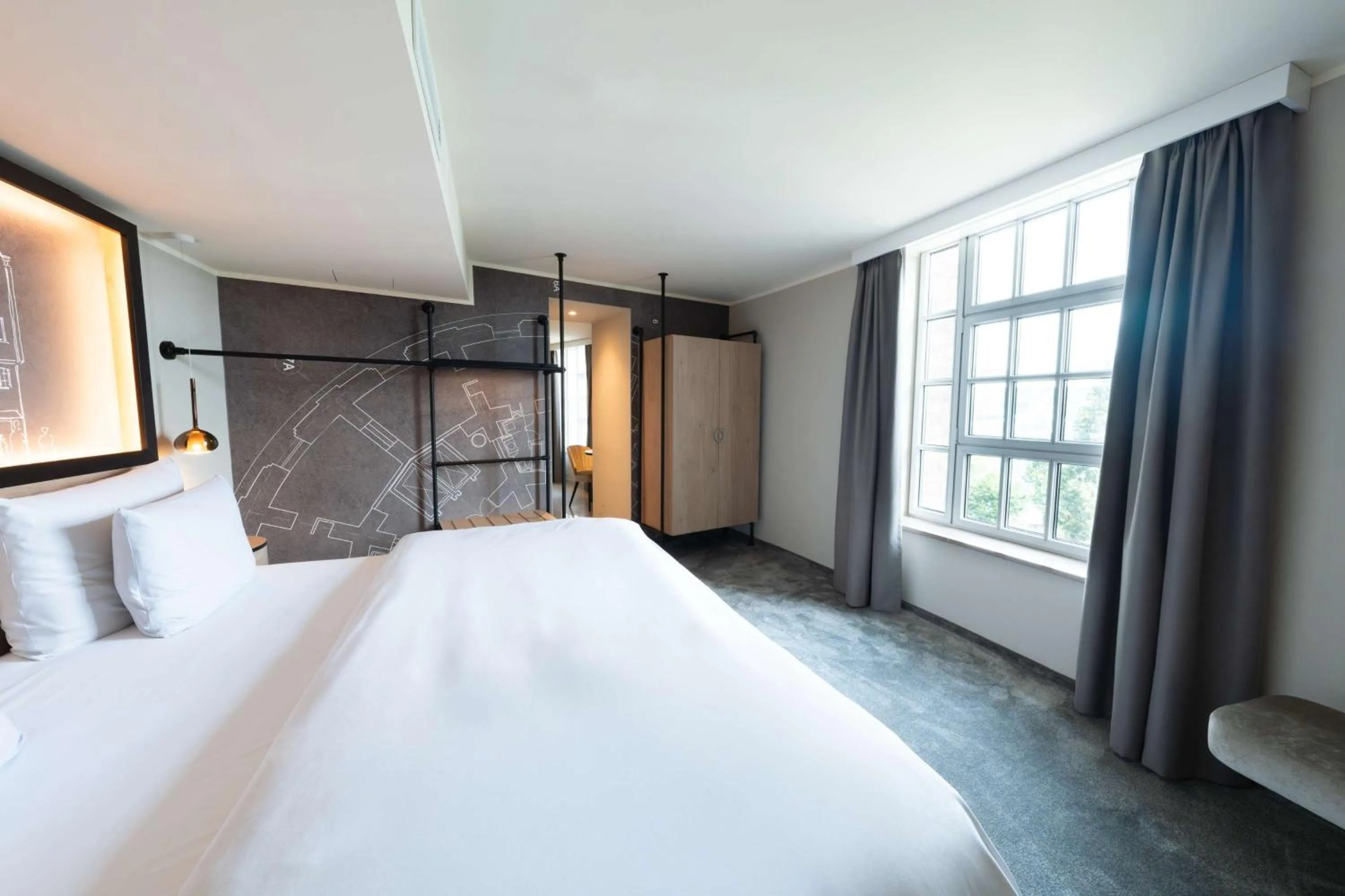 Bed in Wasserturm Hotel Cologne, Curio Collection by Hilton