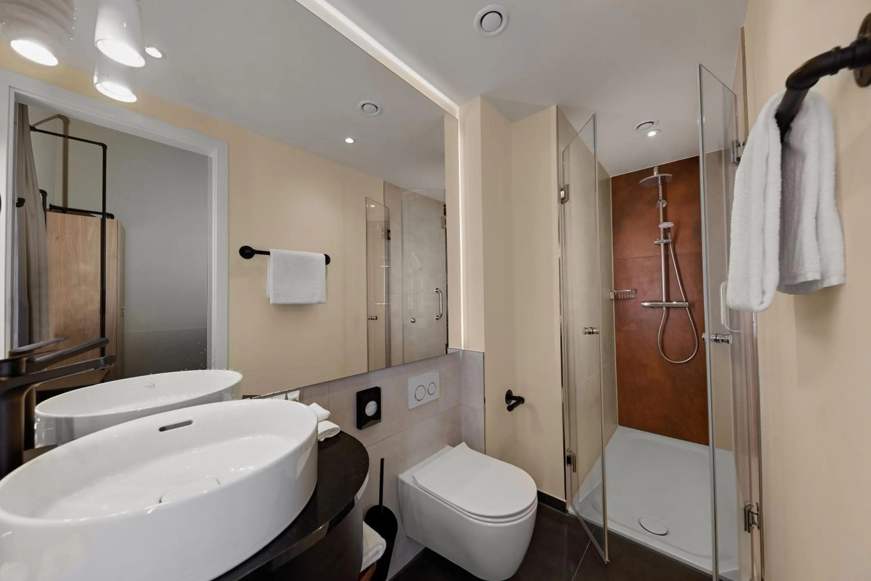 Bathroom in Wasserturm Hotel Cologne, Curio Collection by Hilton