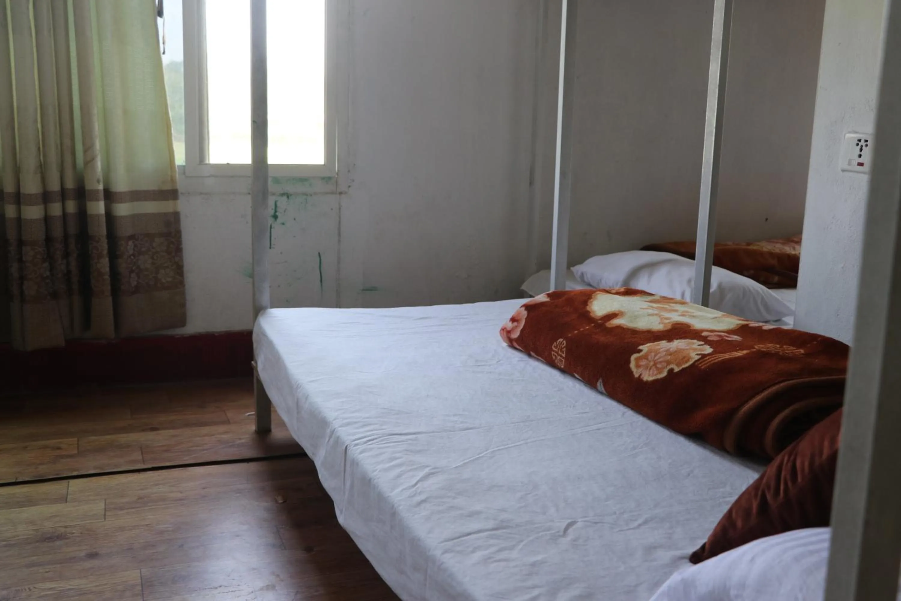 Bed in Hong Qi Hotel