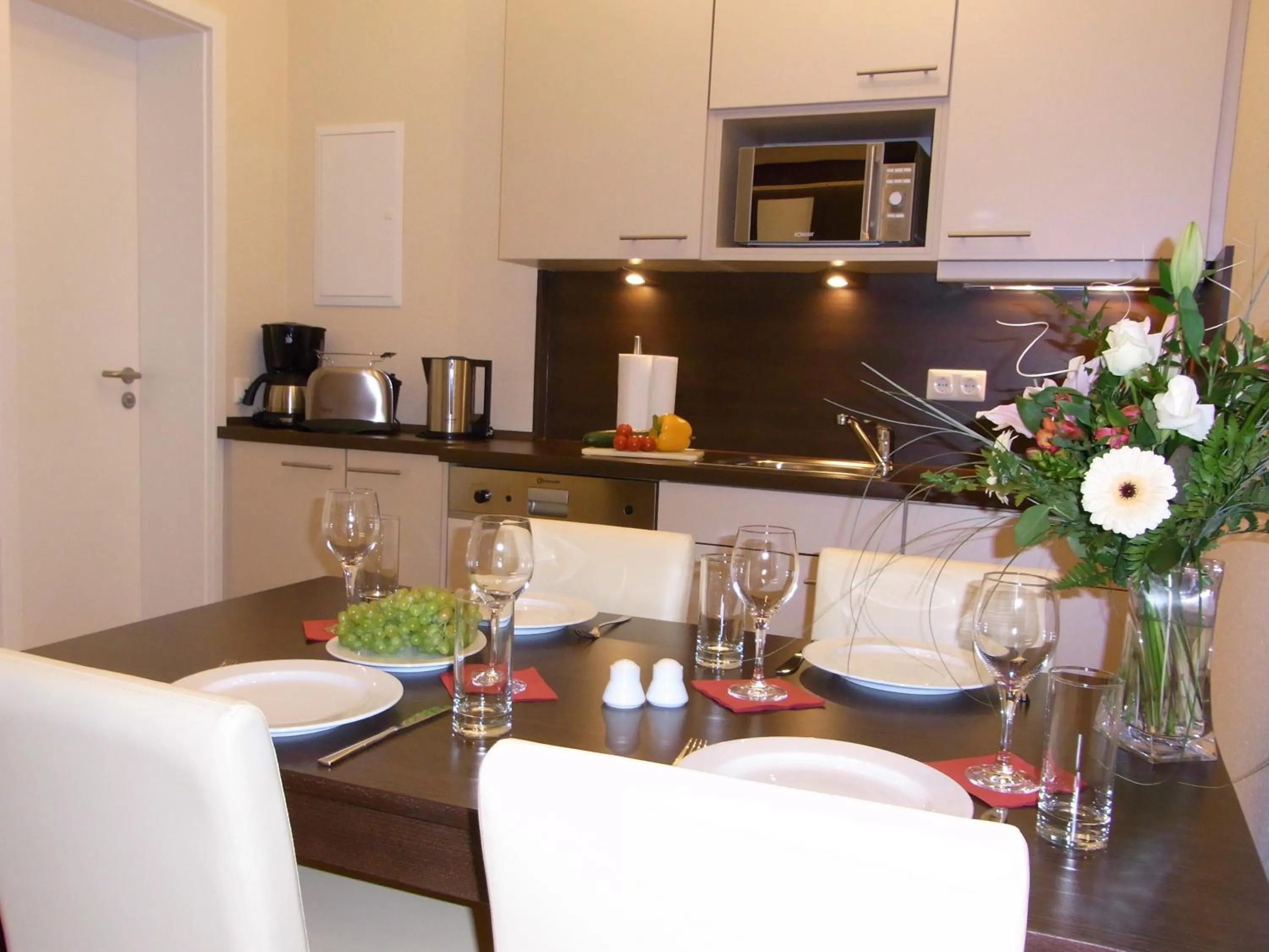 Kitchen or kitchenette in Apartmenthotel Quartier M