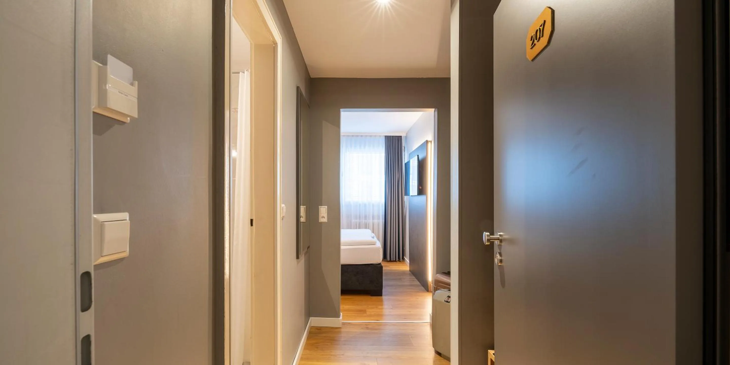 Photo of the whole room, Bed in PLAZA INN Rieker Stuttgart Hauptbahnhof