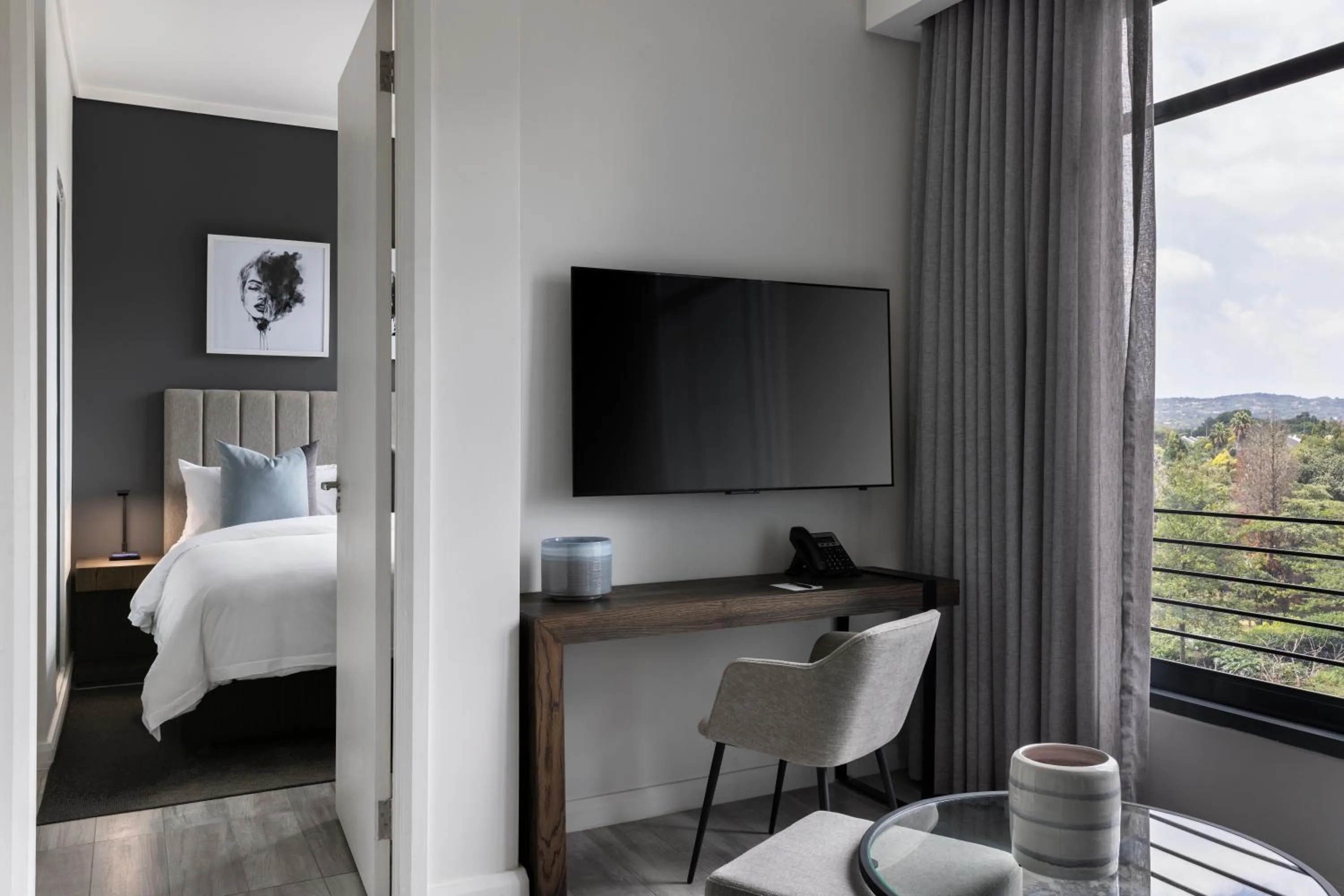 Communal lounge/ TV room, Bed in The Capital Trilogy Menlyn Maine