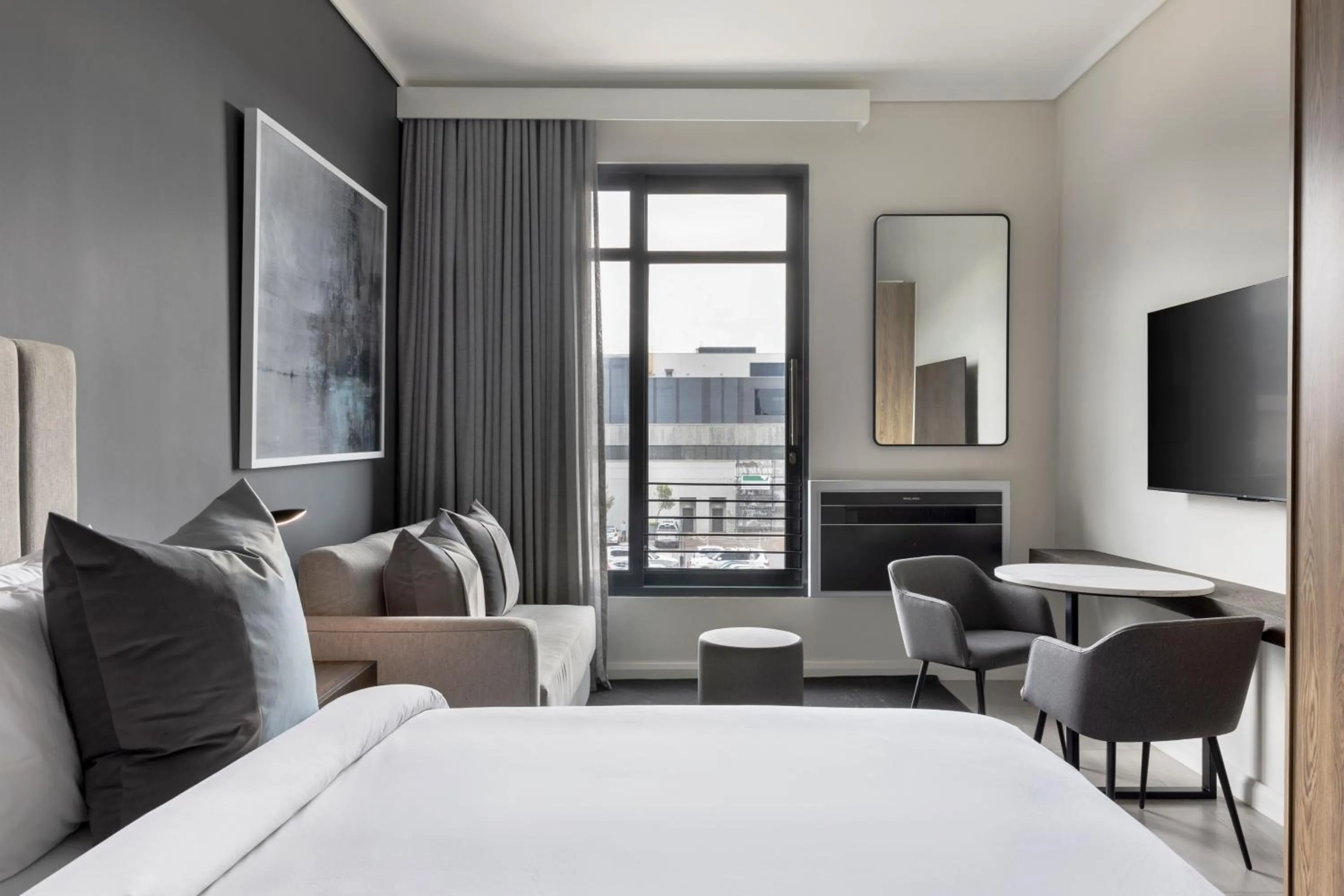 Photo of the whole room, Bed in The Capital Trilogy Menlyn Maine