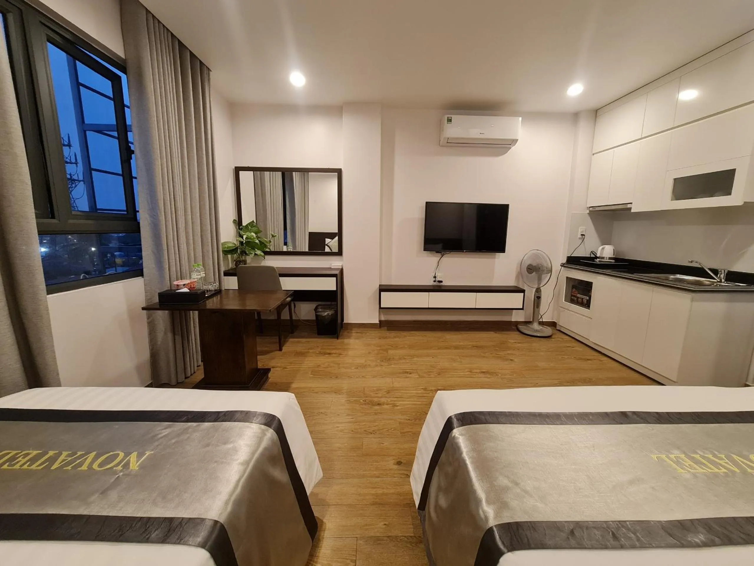 Seating area, Bed in The Nova Hotel & Apartment