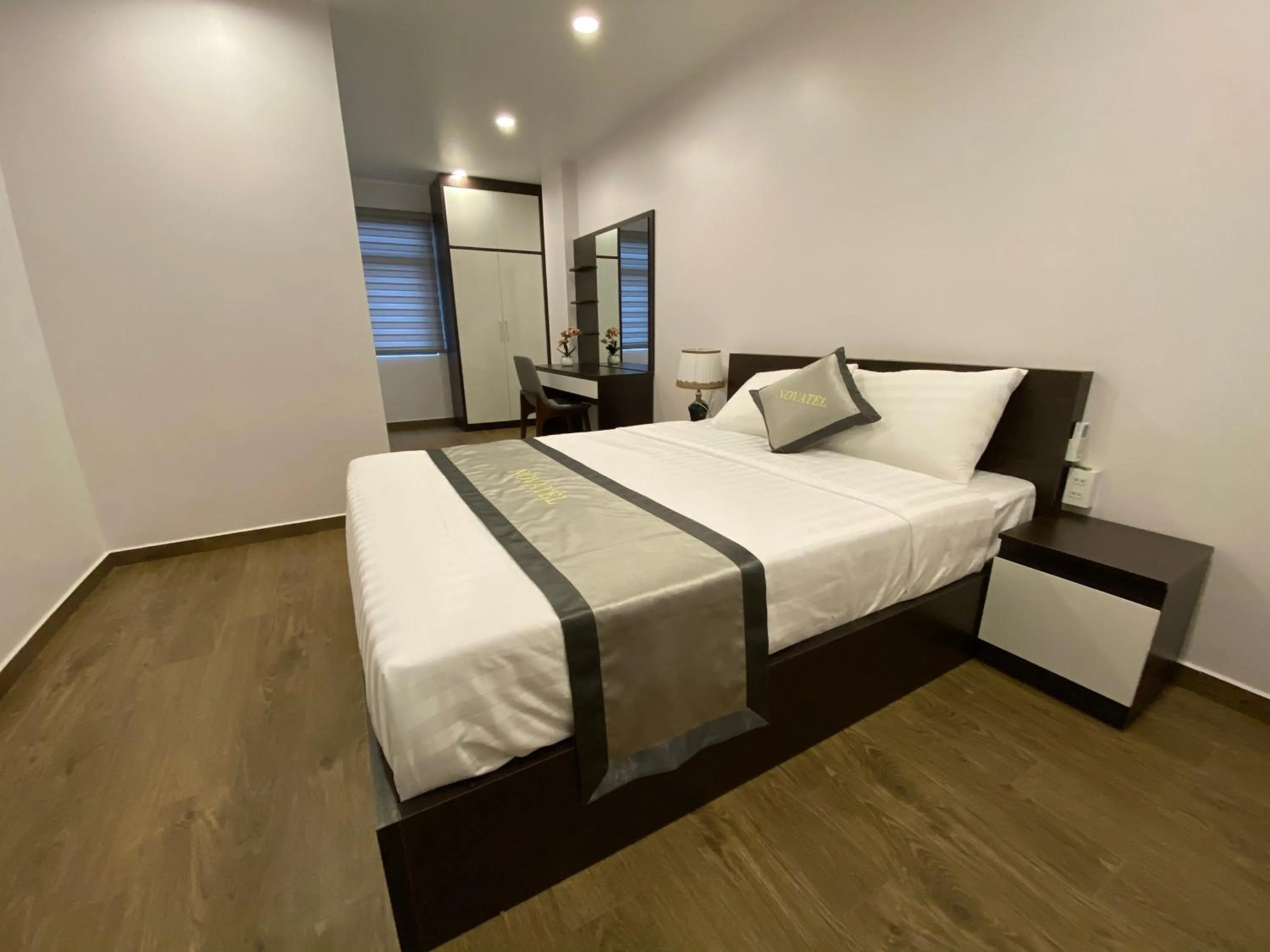 Bed in The Nova Hotel & Apartment