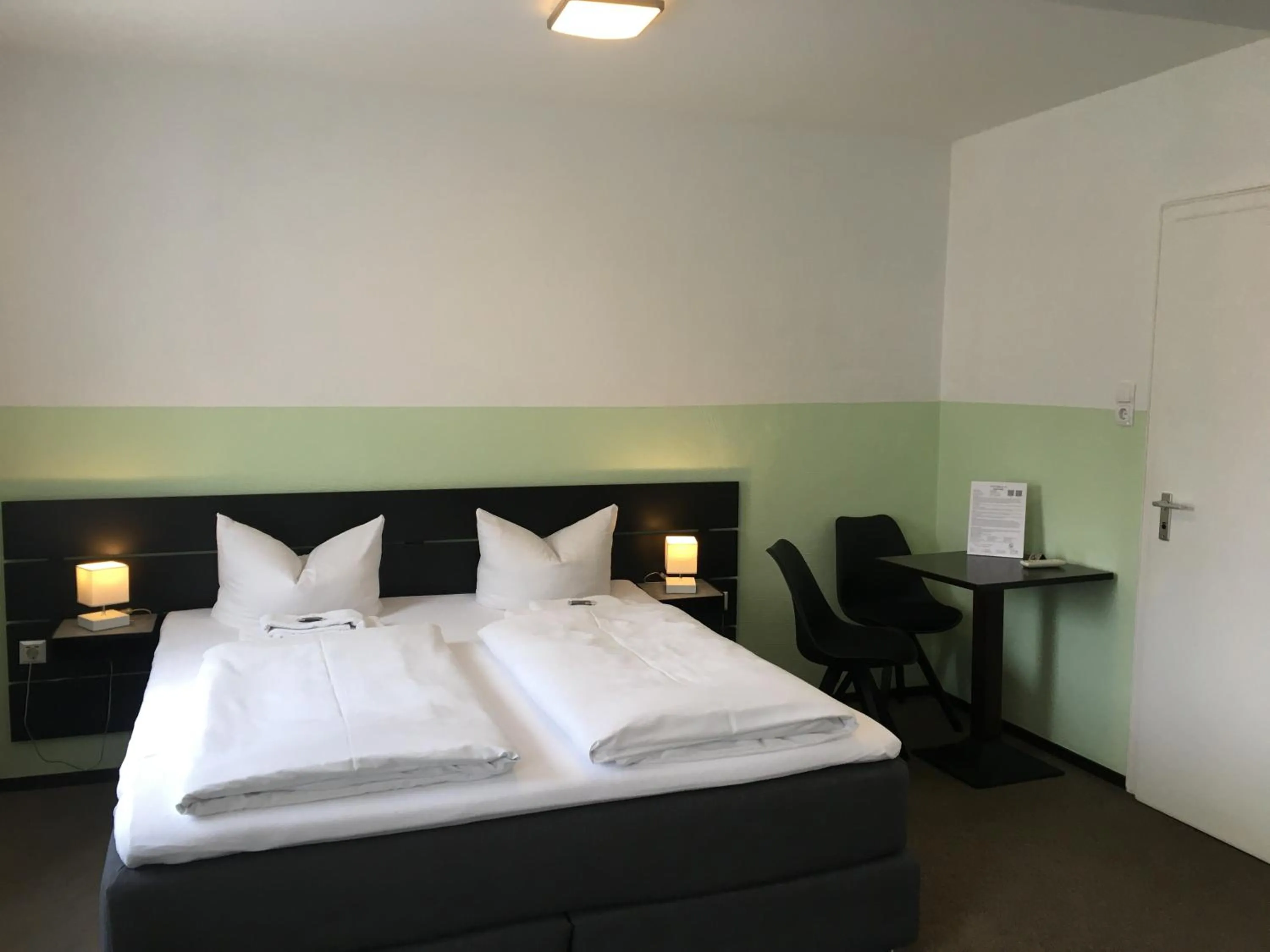 Bed in Hotel Augsburg Goldener Falke