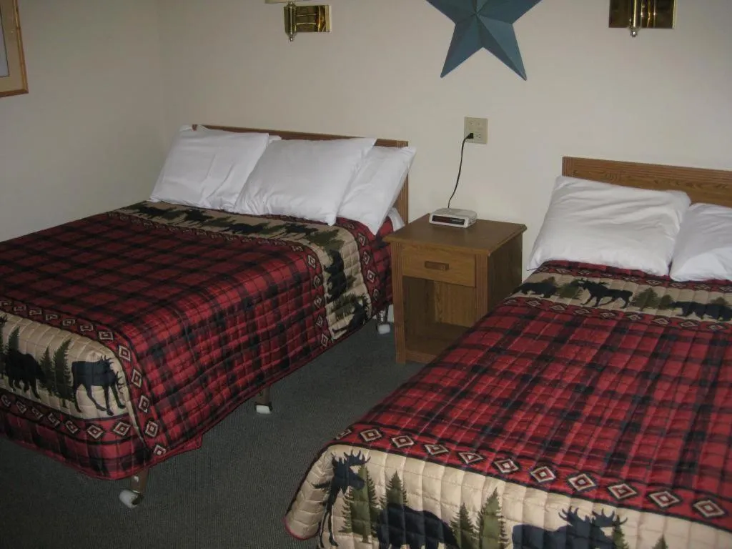 Bed in Brookside Motel & Cabins