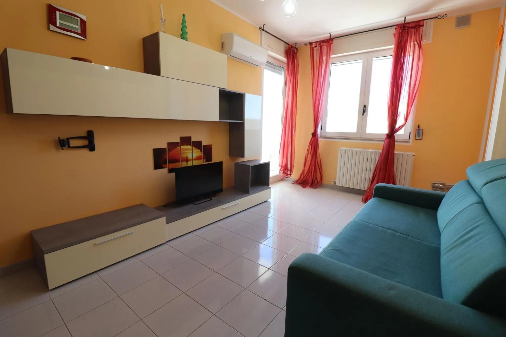 Communal lounge/ TV room in Casa Virginia Elegant One-Bedroom Apartment Near the Beach