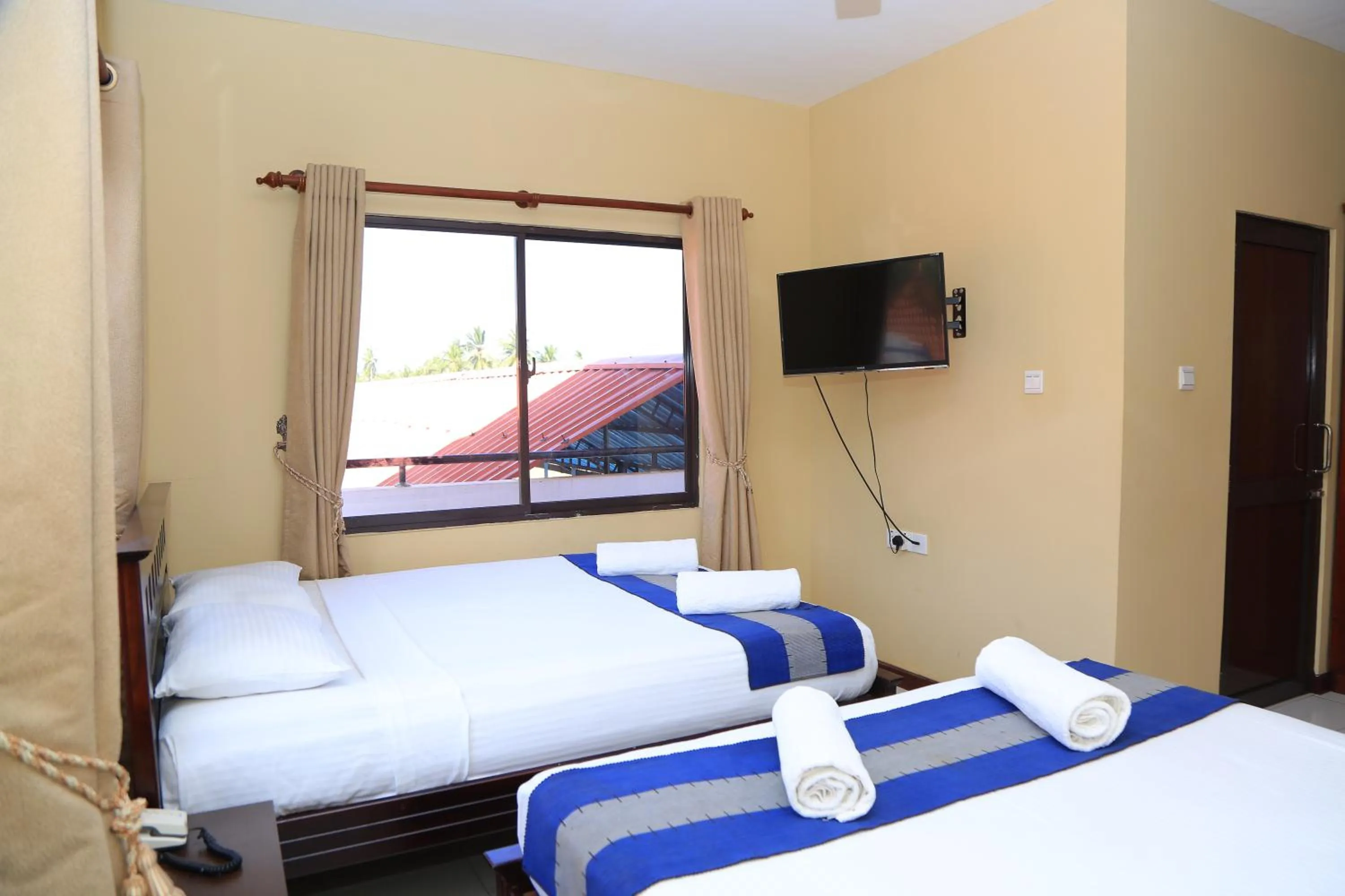 Bed in PJ Hotels Jaffna