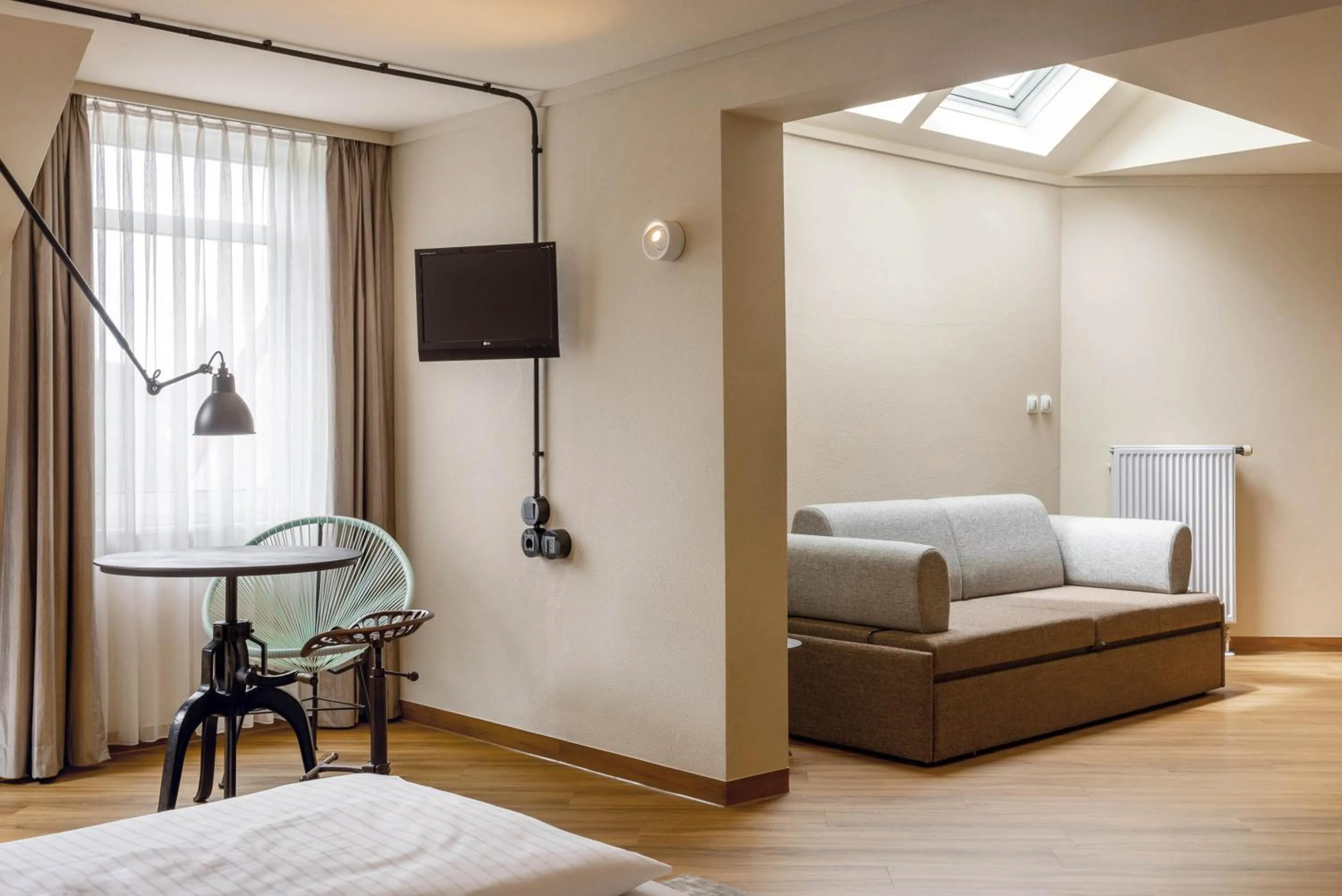 Living room, Bed in Seminaris Hotel Bad Boll