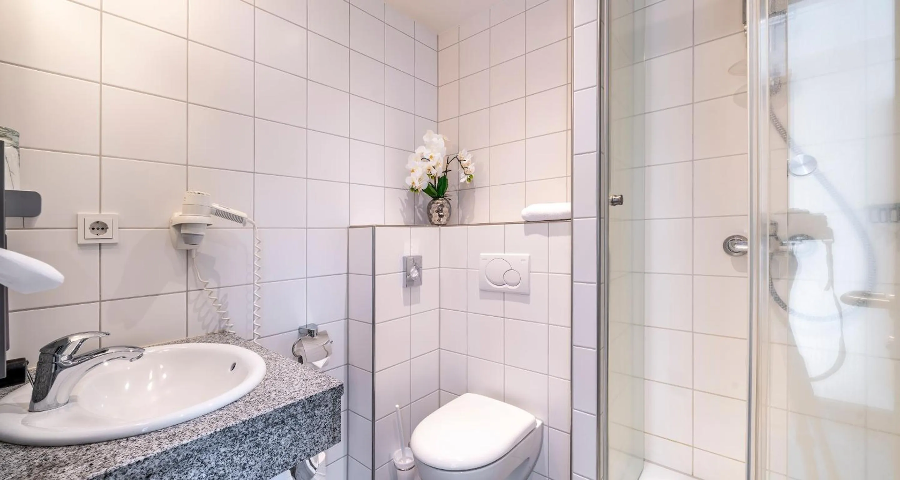 Bathroom in PLAZA INN Heidehof