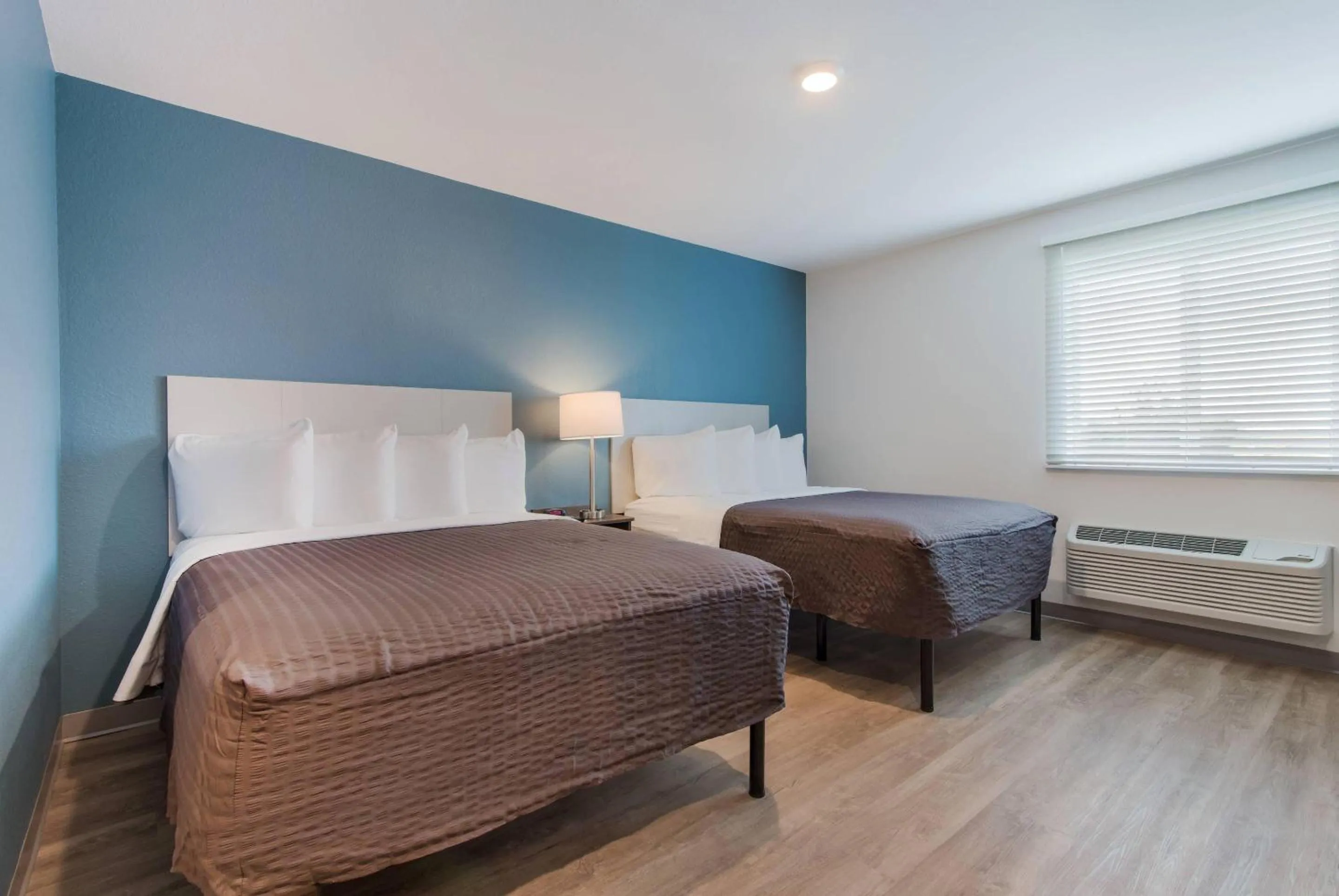 Bedroom, Bed in WoodSpring Suites Tamarac