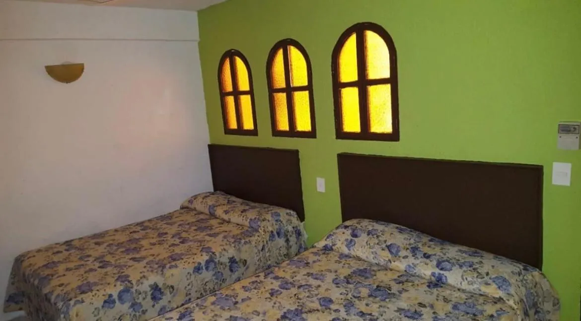 Bed in Hotel magallanes con cocineta 100 Metros de playa