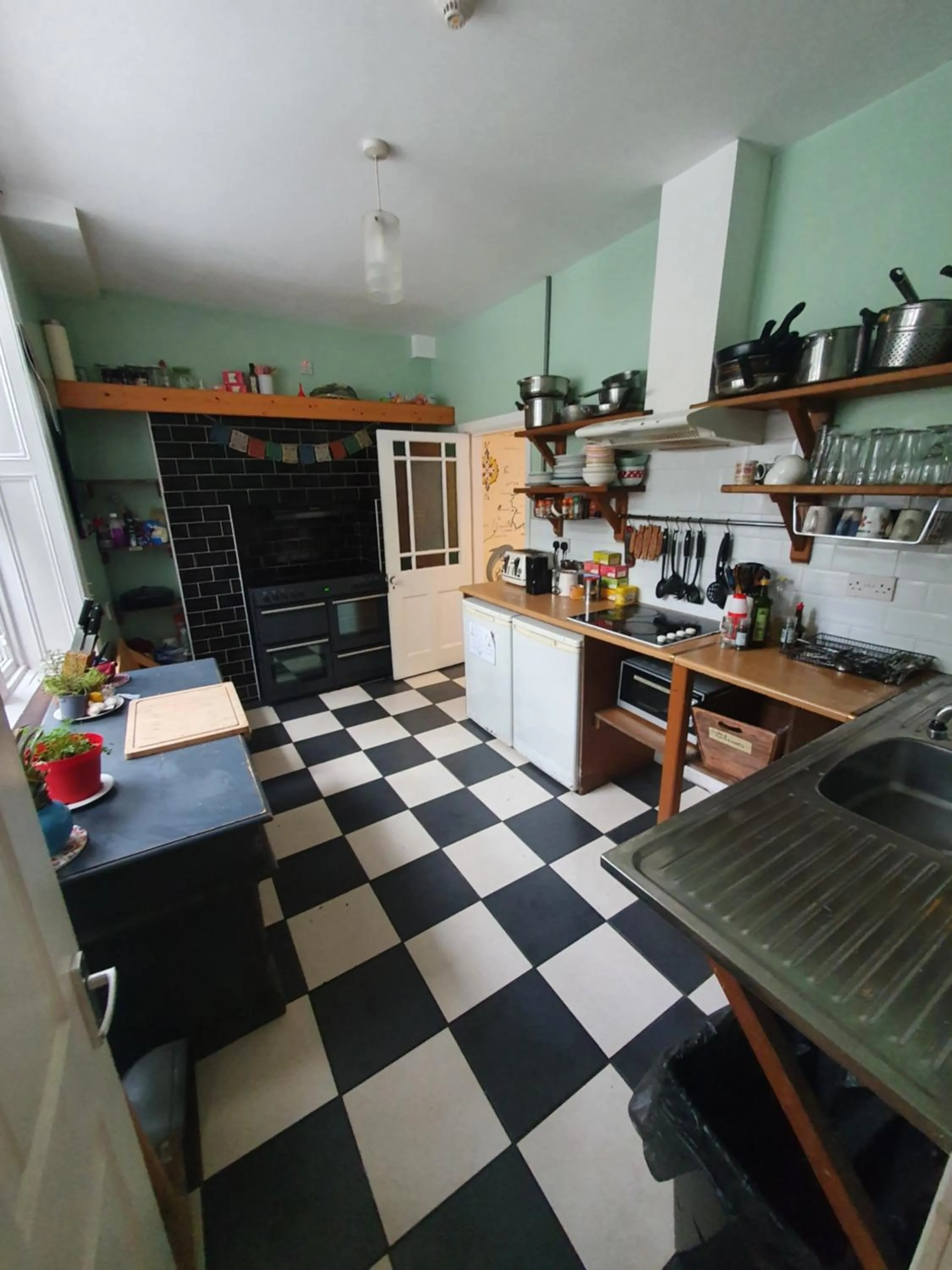 Communal kitchen in The Grapevine Hostel