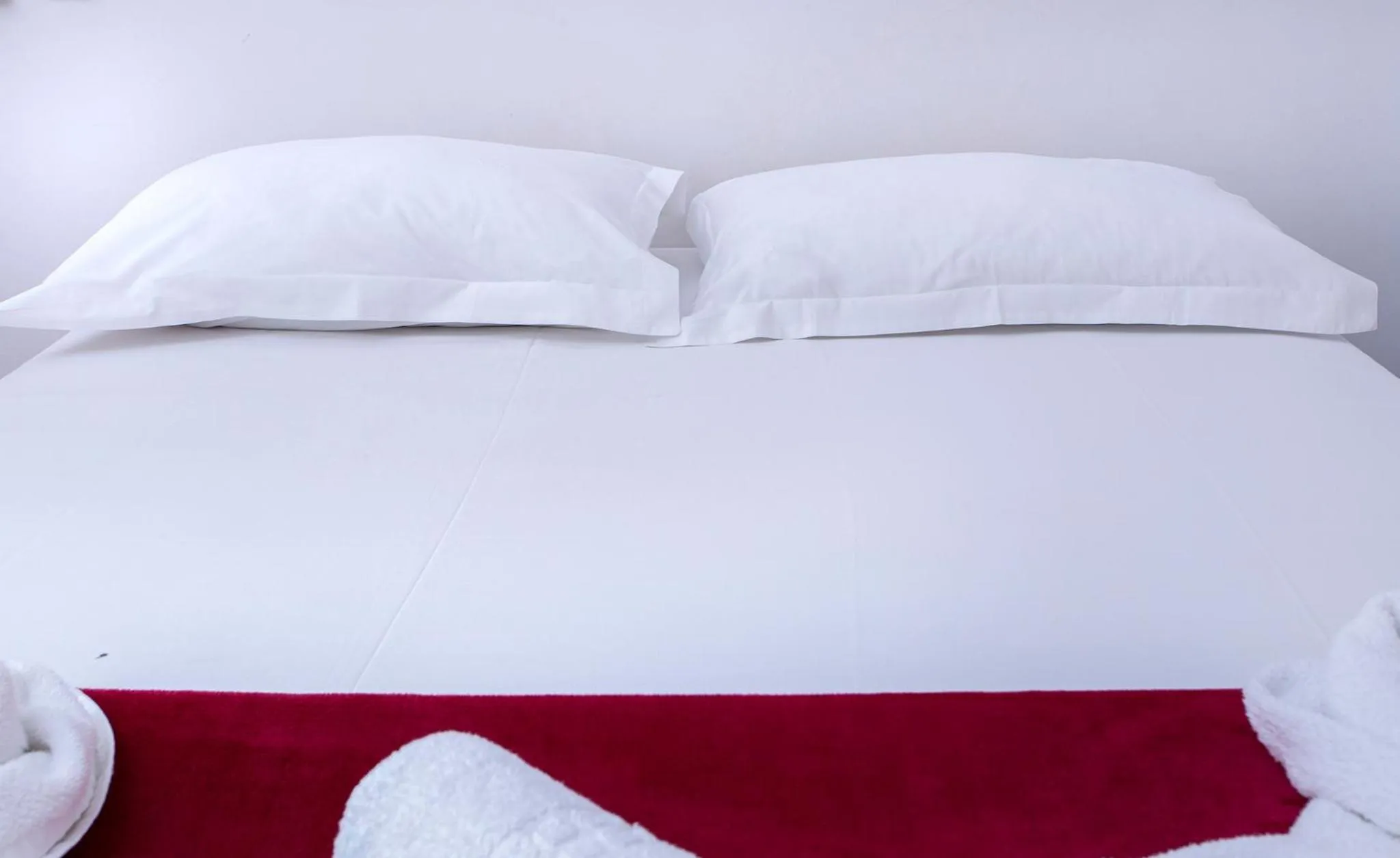 Bed in Pousada Guarubela Veloso