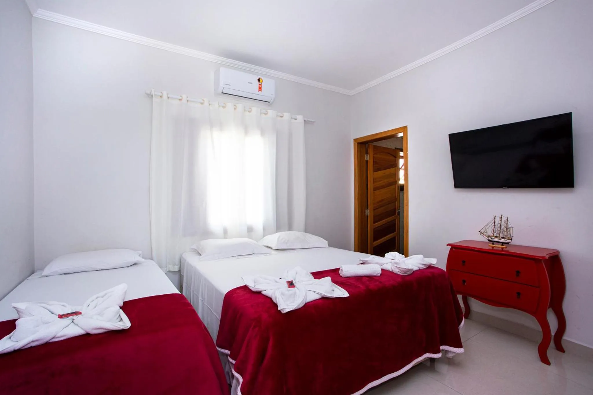 Bed in Pousada Guarubela Veloso