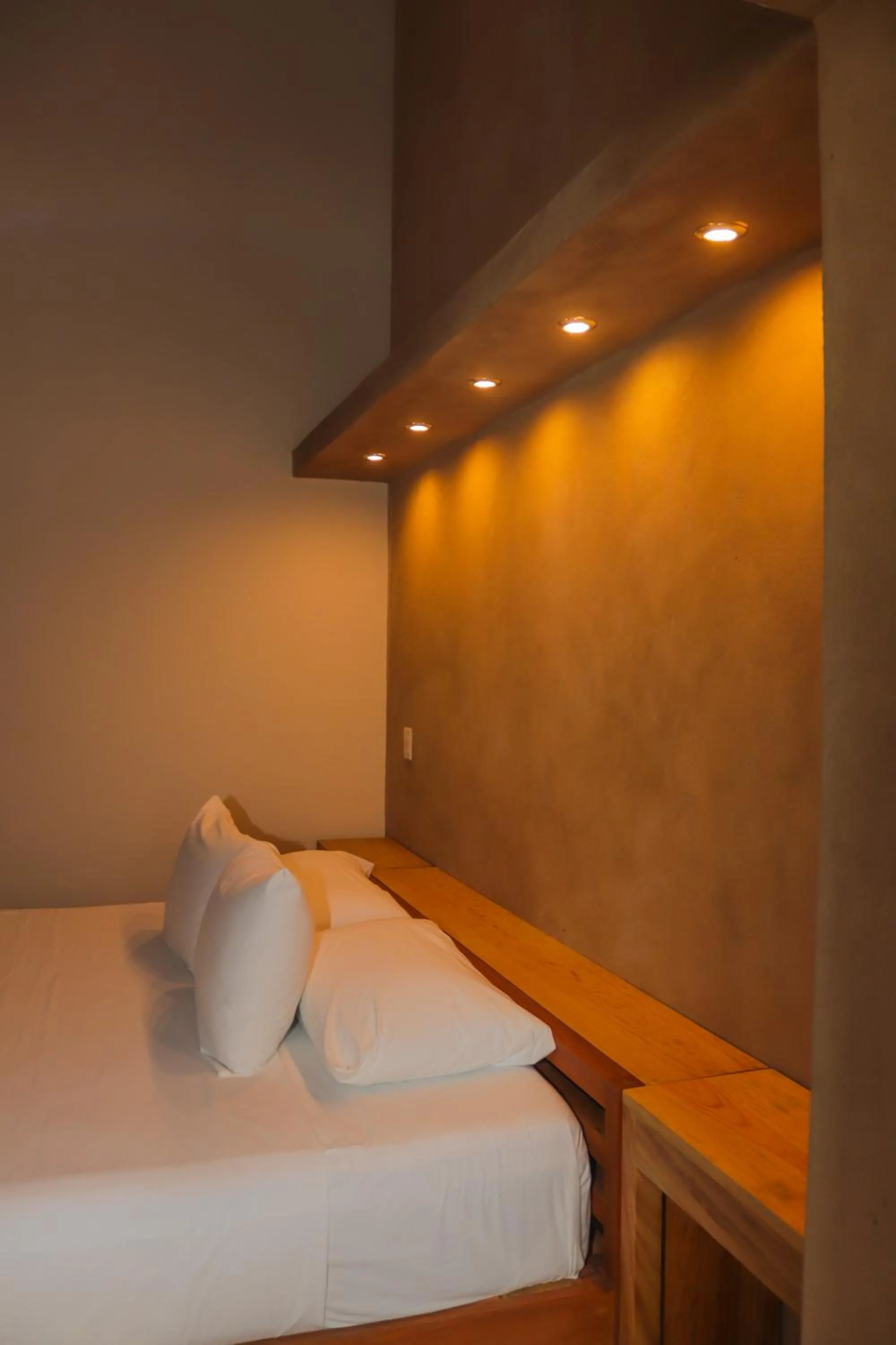 Bed in Hotel Maya Bell